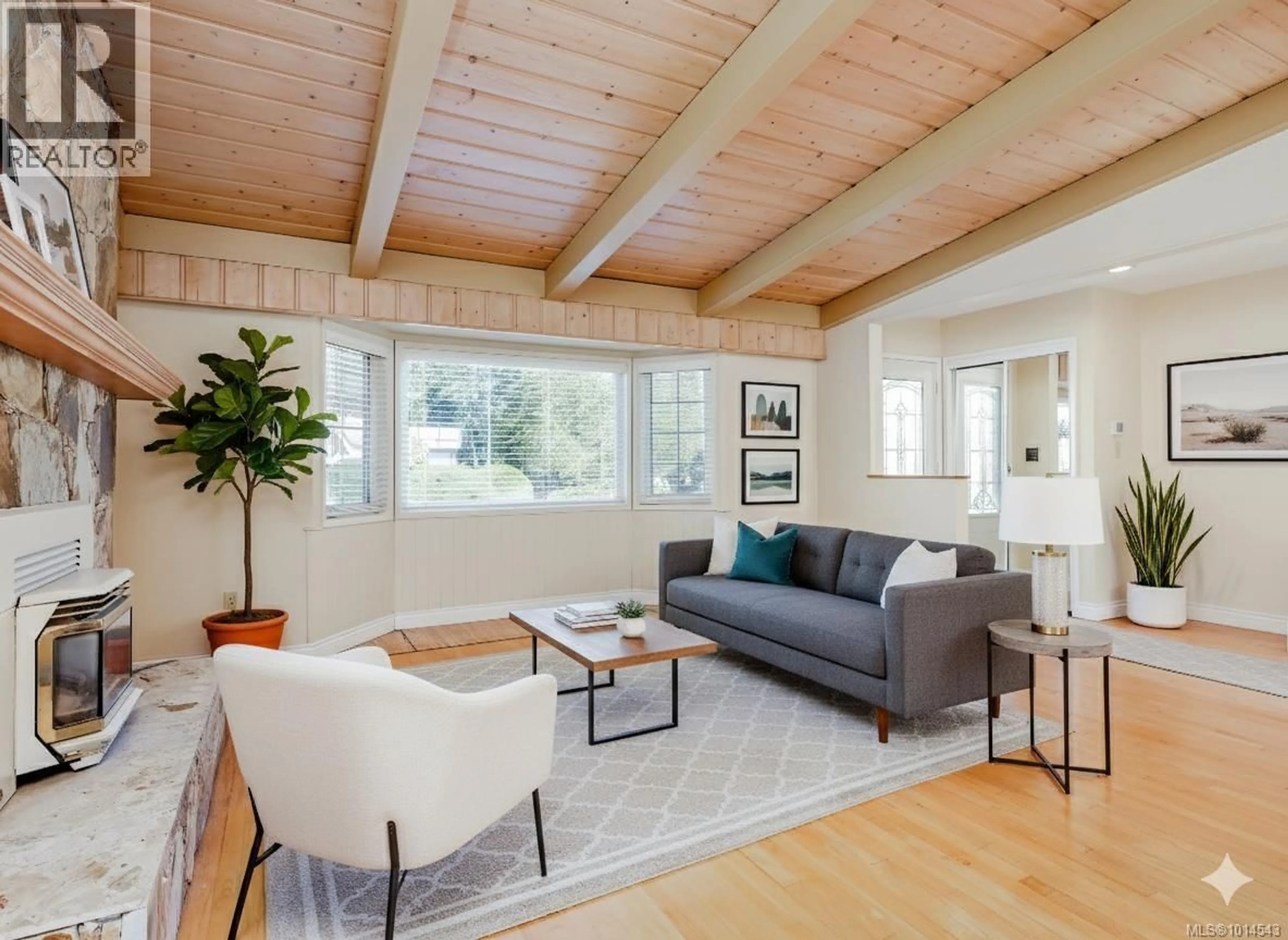Living room with furniture, wood/laminate floor for 1565 JASPER PLACE, Saanich British Columbia V8P1N9