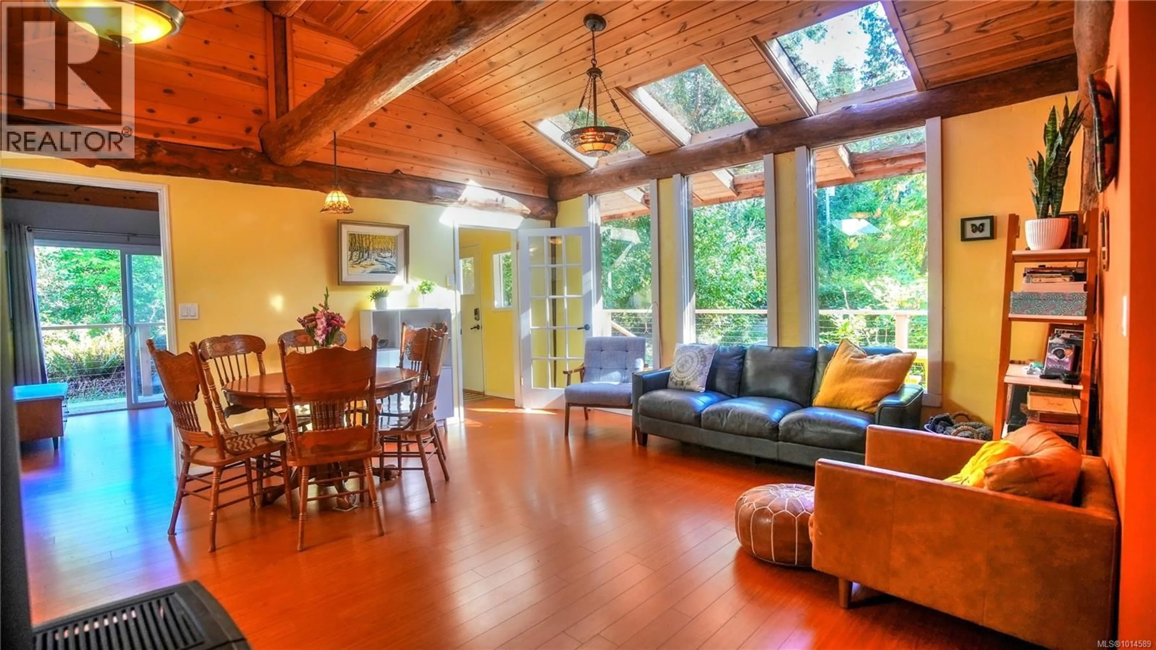Living room with furniture, wood/laminate floor for 5065 SANDPIPER ROAD, Hornby Island British Columbia V0R1Z0