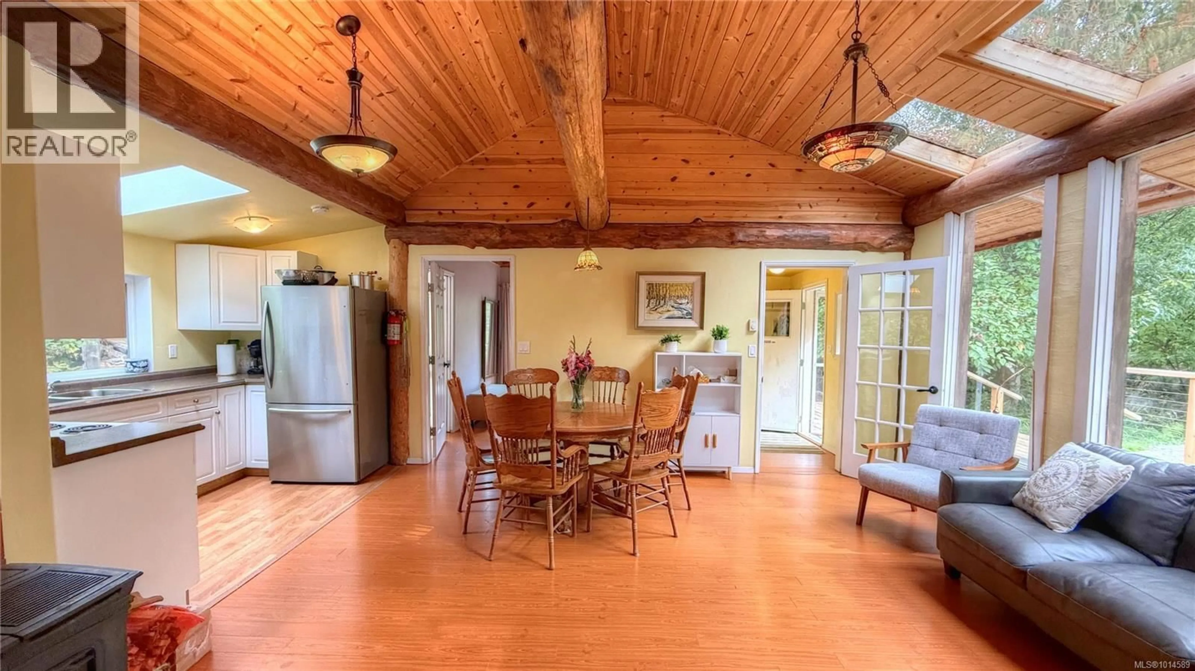 Dining room, wood/laminate floor for 5065 SANDPIPER ROAD, Hornby Island British Columbia V0R1Z0