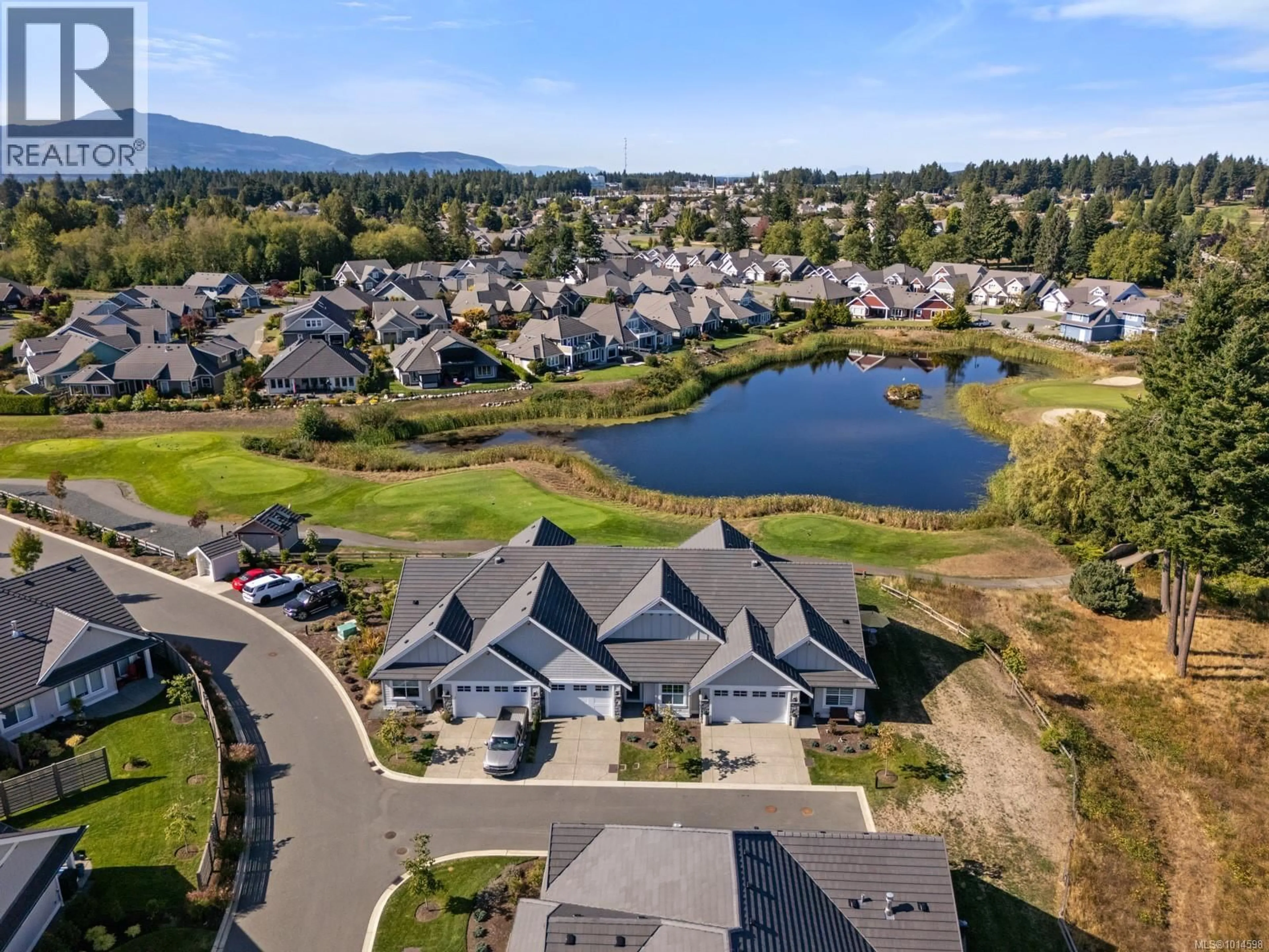 A pic from outside/outdoor area/front of a property/back of a property/a pic from drone, water/lake/river/ocean view for 106 - 1444 CROWN ISLE DRIVE, Courtenay British Columbia V9N0B8