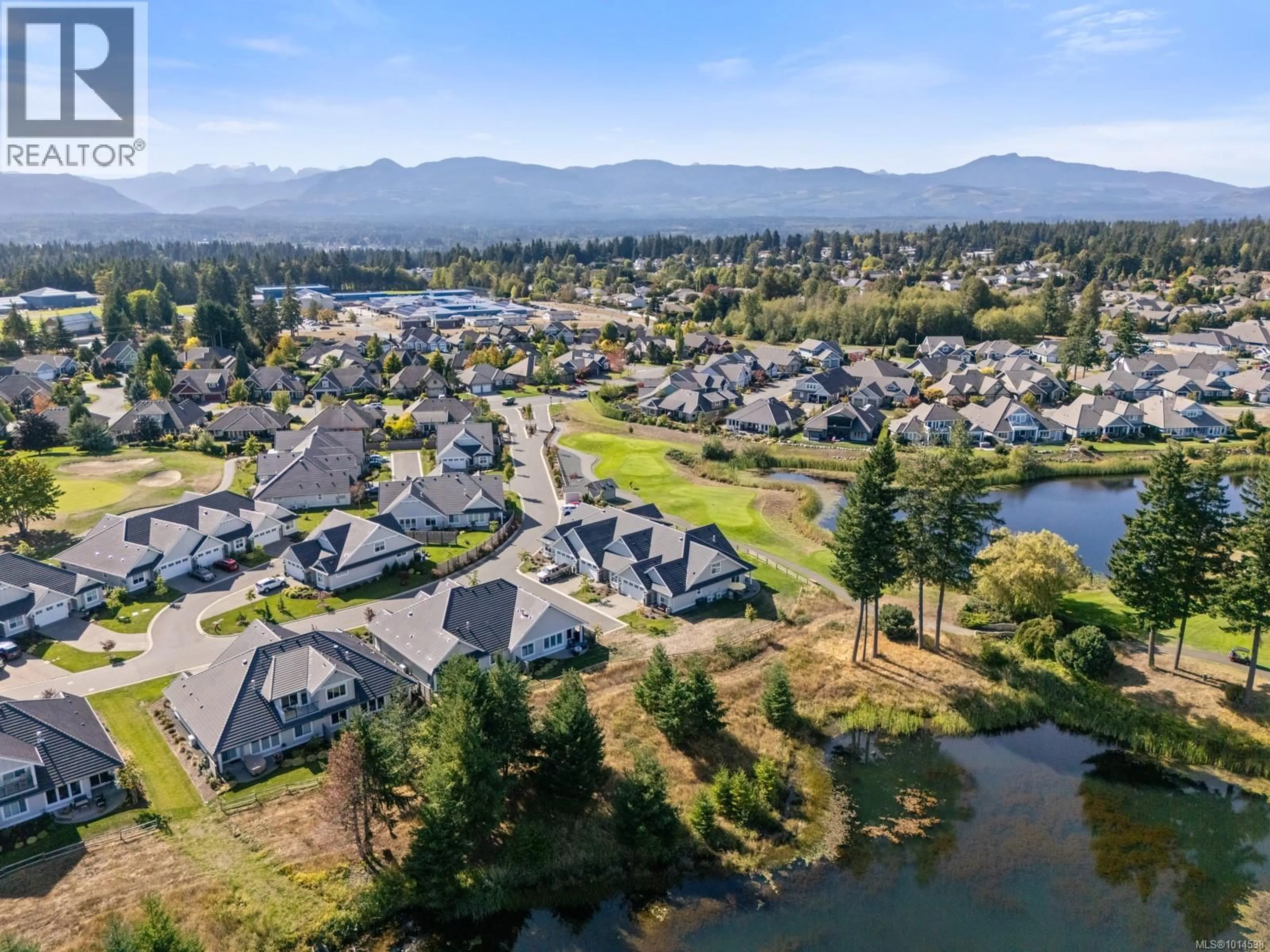 A pic from outside/outdoor area/front of a property/back of a property/a pic from drone, water/lake/river/ocean view for 106 - 1444 CROWN ISLE DRIVE, Courtenay British Columbia V9N0B8