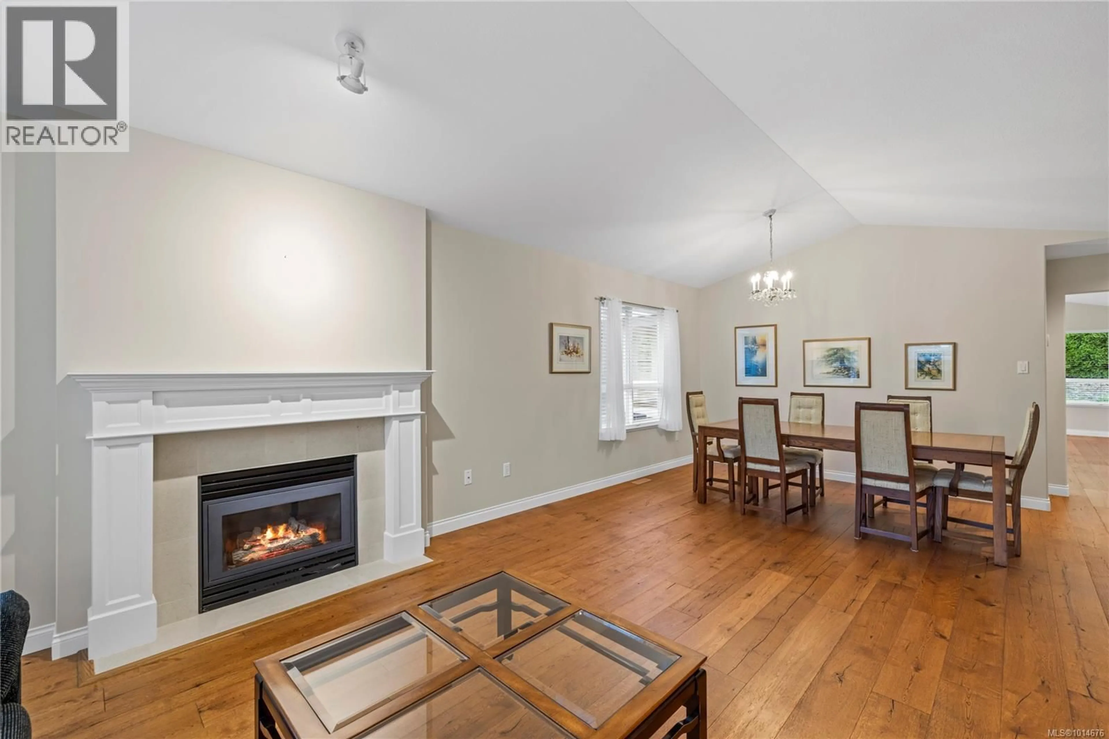 Living room with furniture, wood/laminate floor for 1205 SATURNA DRIVE, Parksville British Columbia V9P2X5