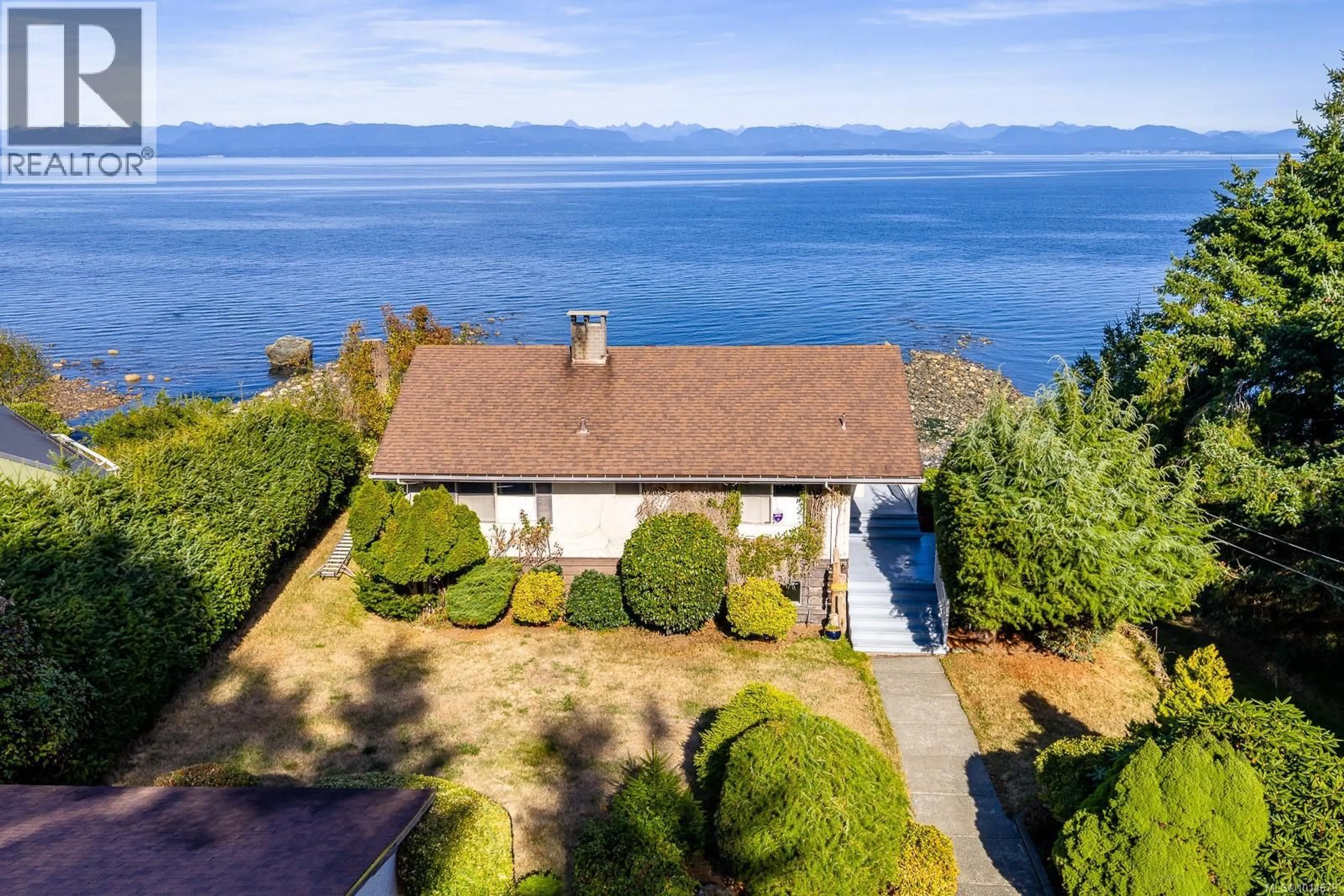 A pic from outside/outdoor area/front of a property/back of a property/a pic from drone, water/lake/river/ocean view for 2332 SEABANK ROAD, Courtenay British Columbia V9J1X5