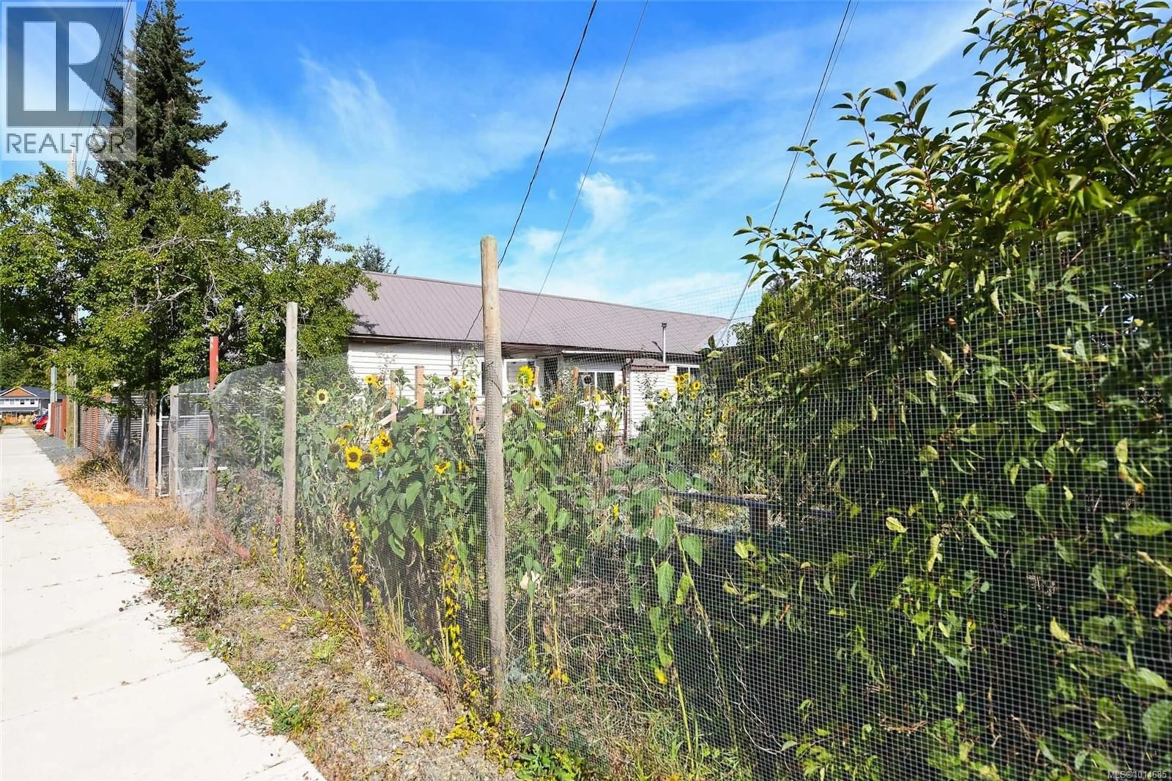 A pic from outside/outdoor area/front of a property/back of a property/a pic from drone, street for 3390 NIKKEI PLACE, Cumberland British Columbia V0R1S0