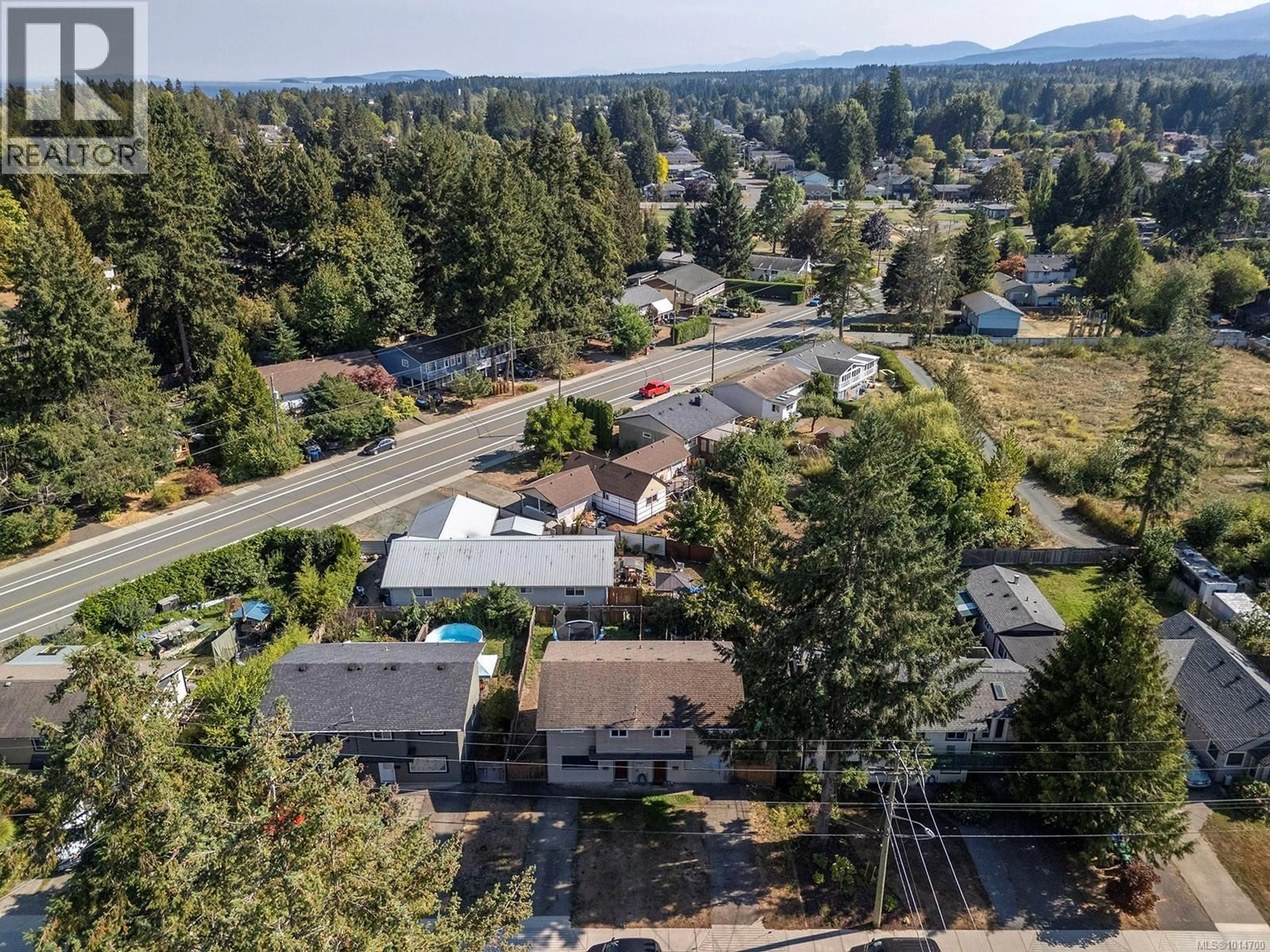 A pic from outside/outdoor area/front of a property/back of a property/a pic from drone, mountain view for 1170 14TH STREET, Courtenay British Columbia V9N1W9