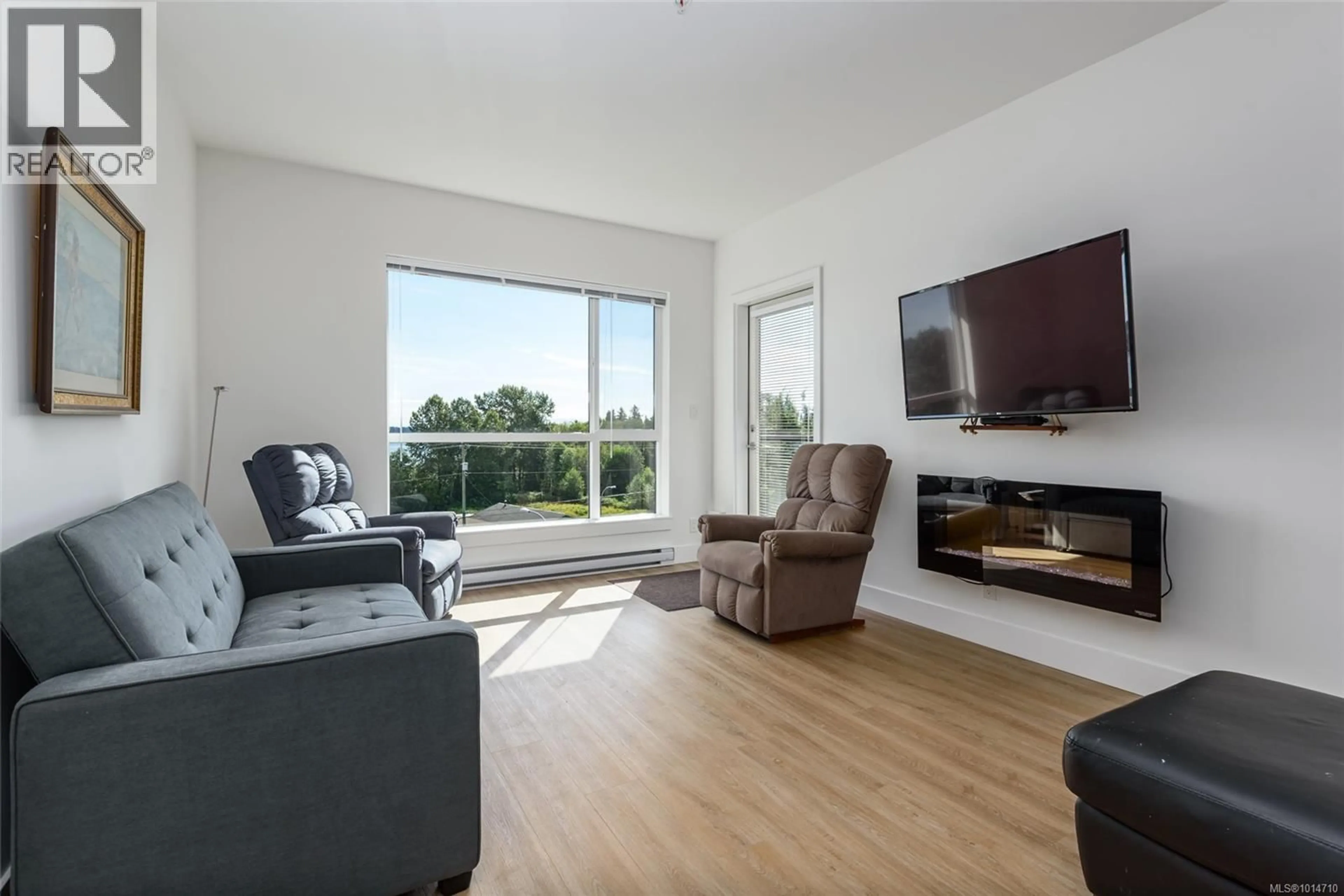 Living room with furniture, wood/laminate floor for PH04 - 3070 KILPATRICK AVENUE, Courtenay British Columbia V9N0G7