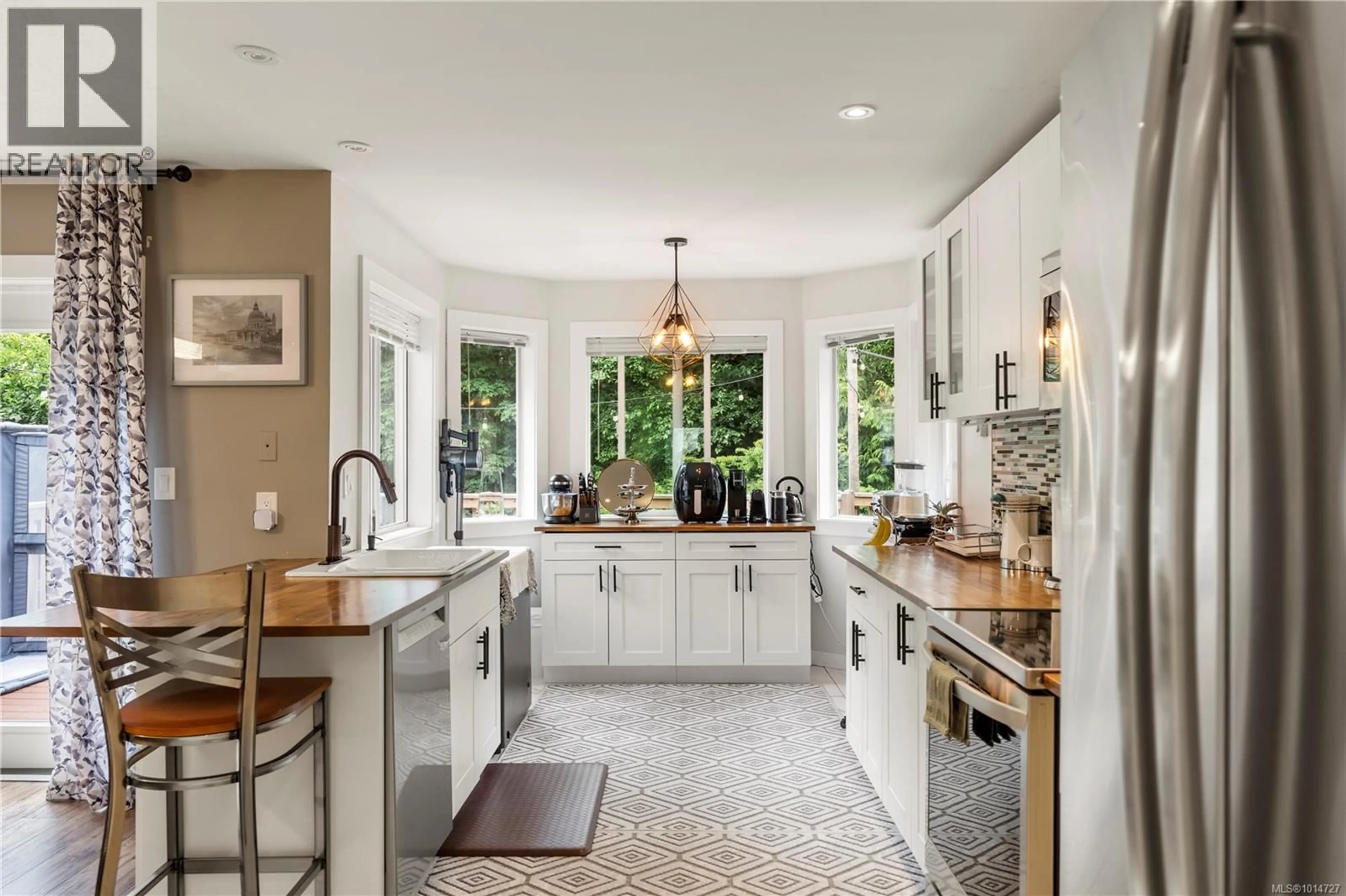 Open concept kitchen, ceramic/tile floor for 5839 BLYTHWOOD ROAD, Sooke British Columbia V9Z0G3