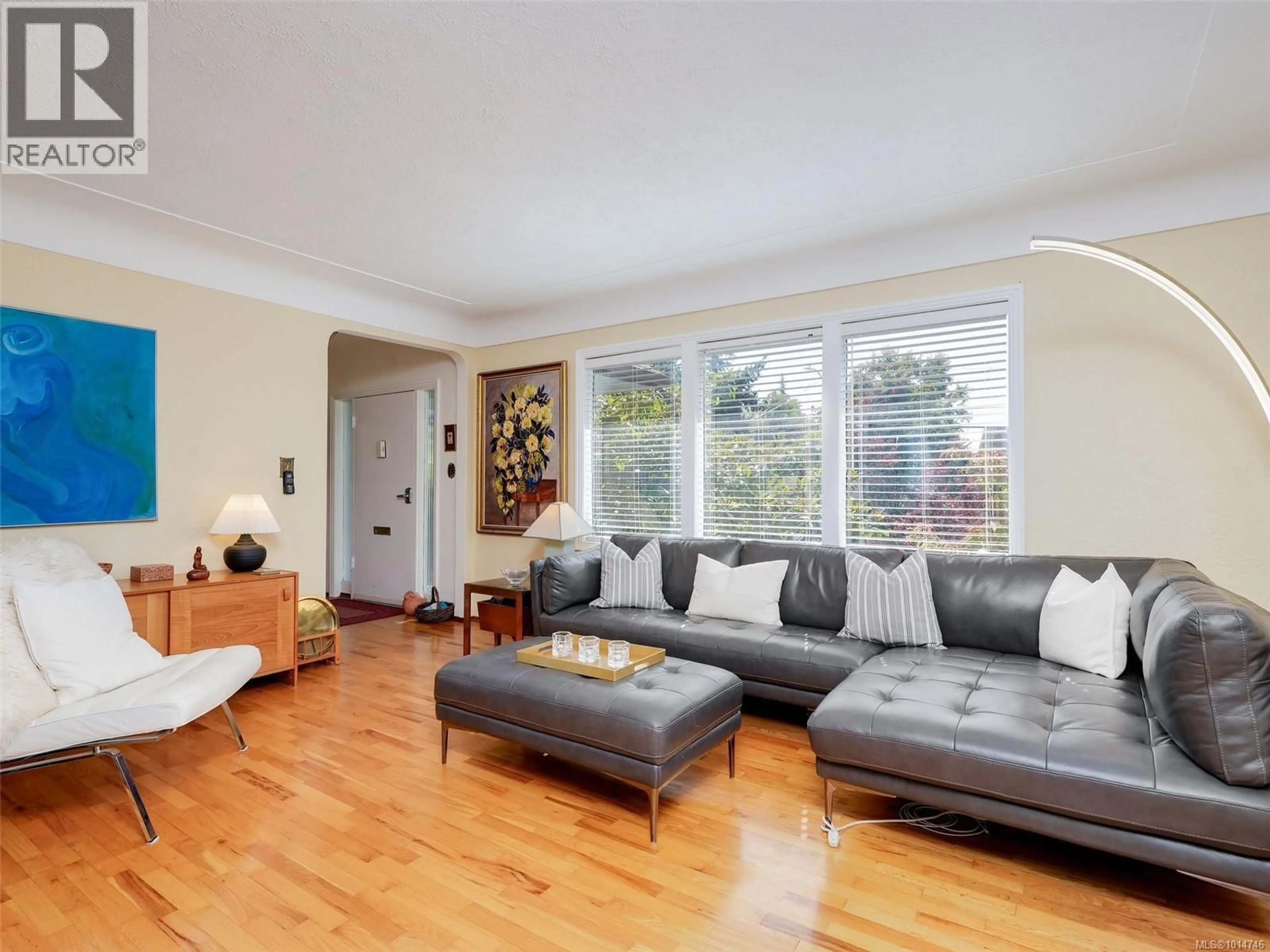 Living room with furniture, wood/laminate floor for 1874 TAYLOR STREET, Saanich British Columbia V8R3G4