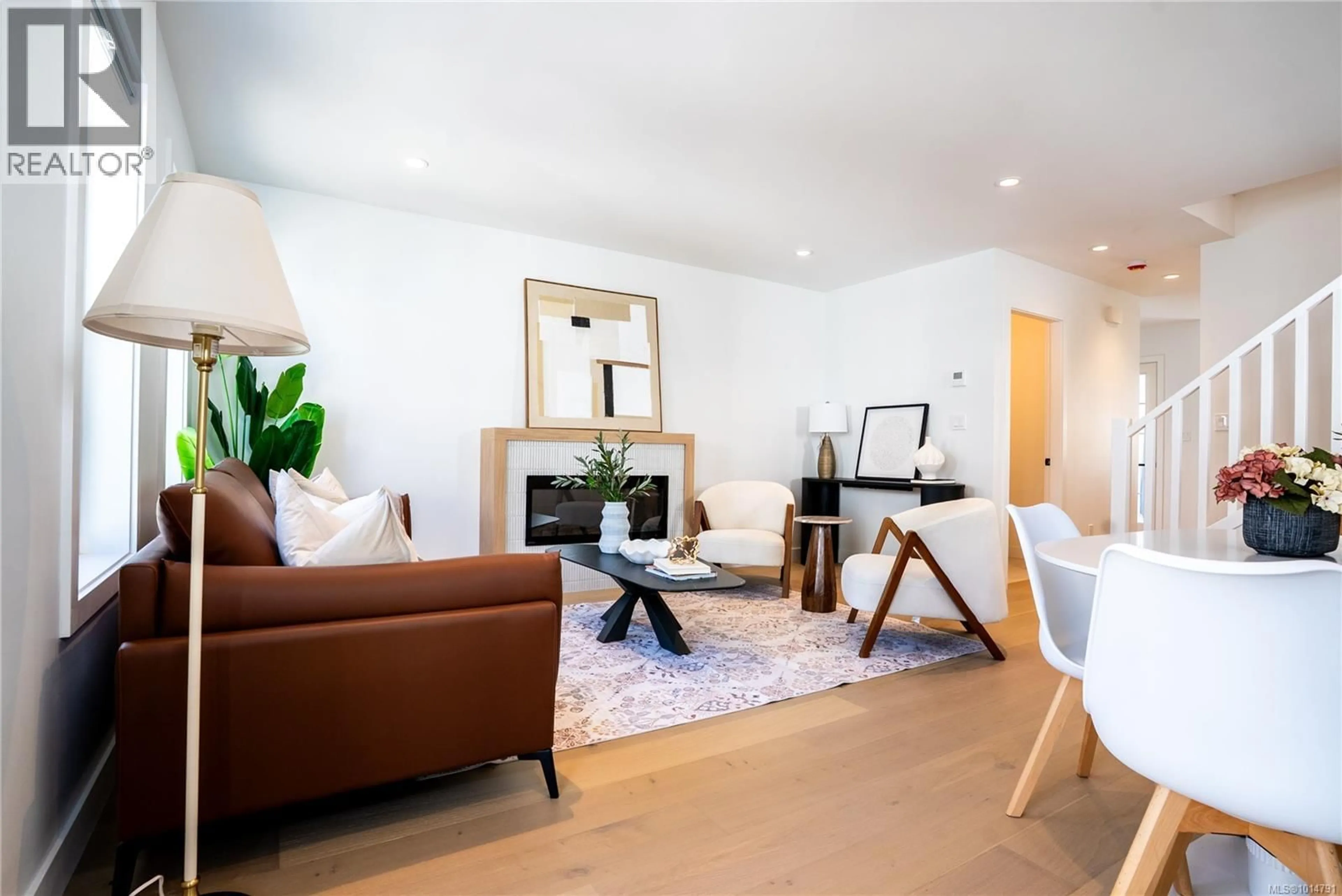 Living room with furniture, wood/laminate floor for Unit 4 - 3907 CEDAR HILL ROAD, Saanich British Columbia V8P3Z8