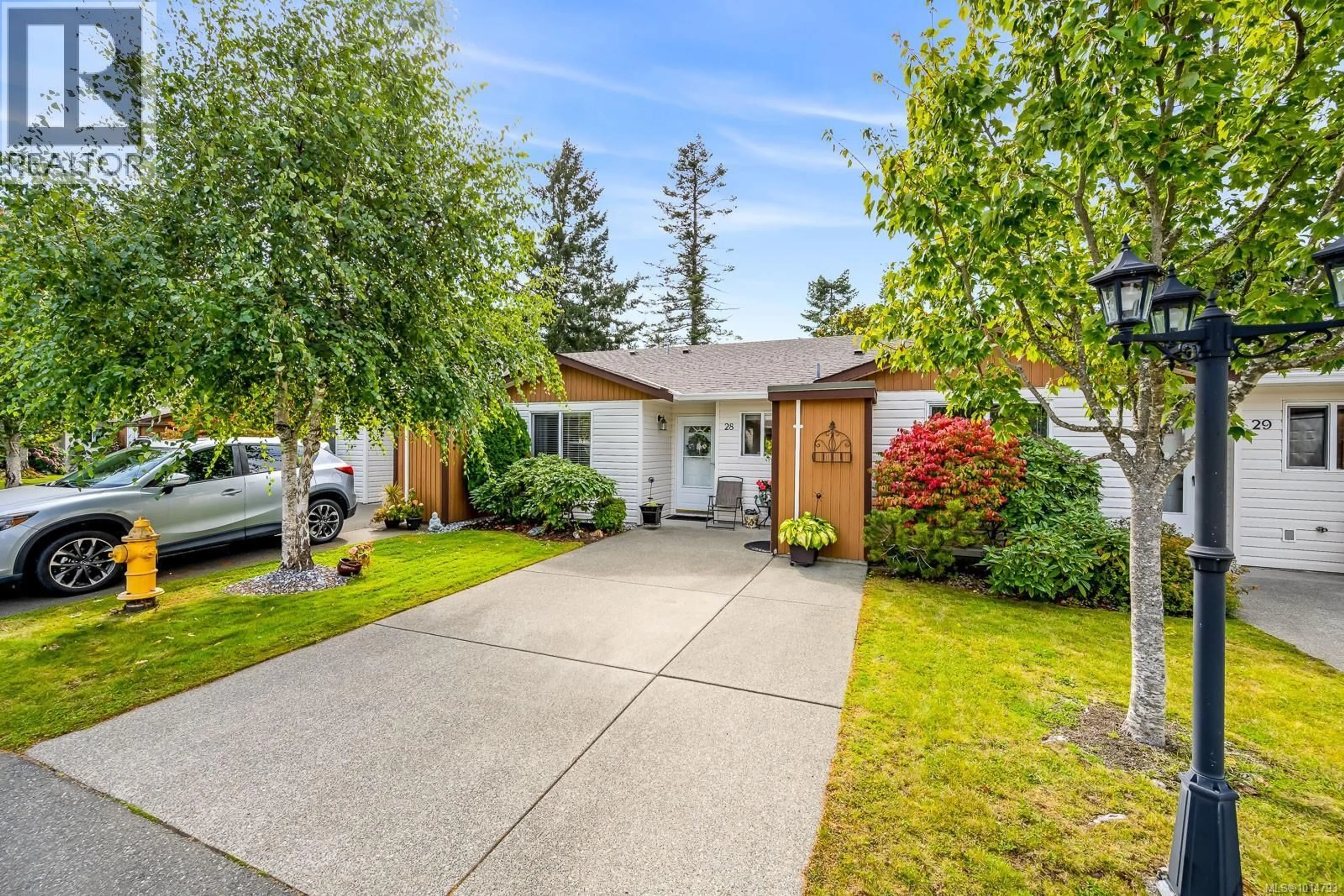 Home with vinyl exterior material, street for 28 - 2197 MURRELET DRIVE, Comox British Columbia V9M3Y1