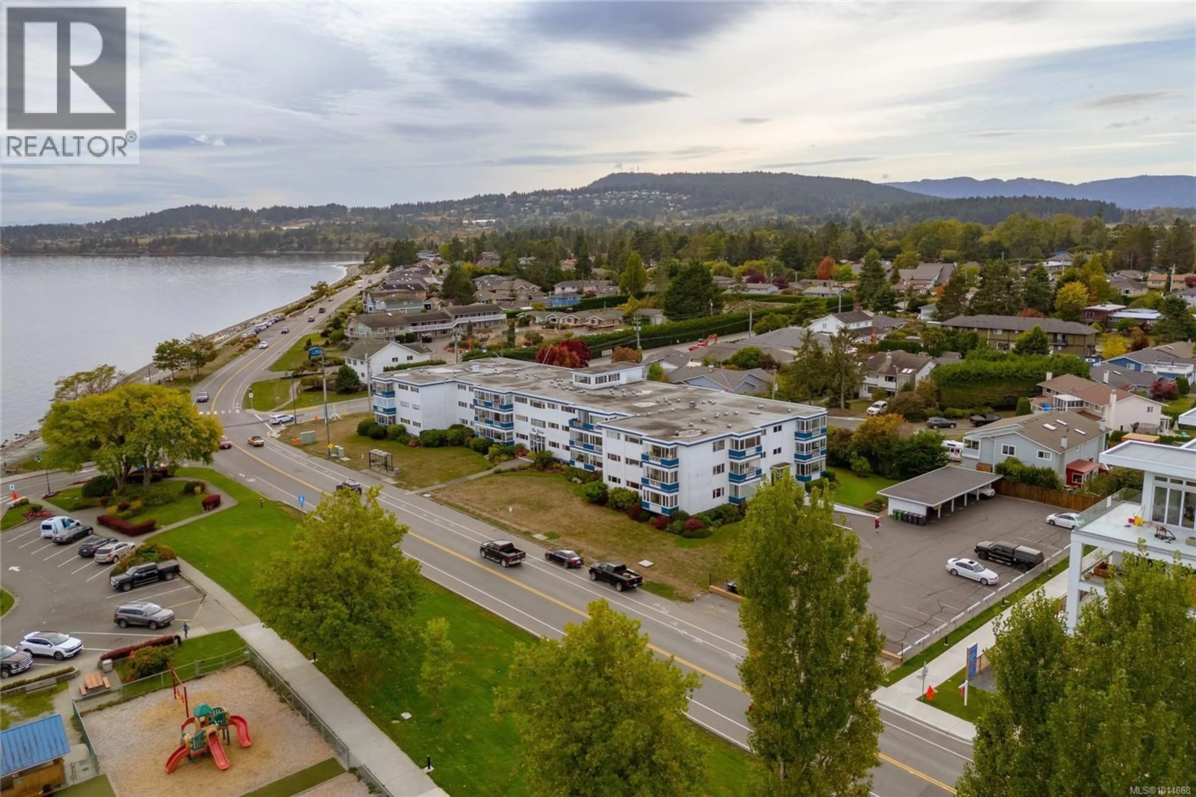 A pic from outside/outdoor area/front of a property/back of a property/a pic from drone, water/lake/river/ocean view for 211 - 9560 FIFTH STREET, Sidney British Columbia V8L2W5