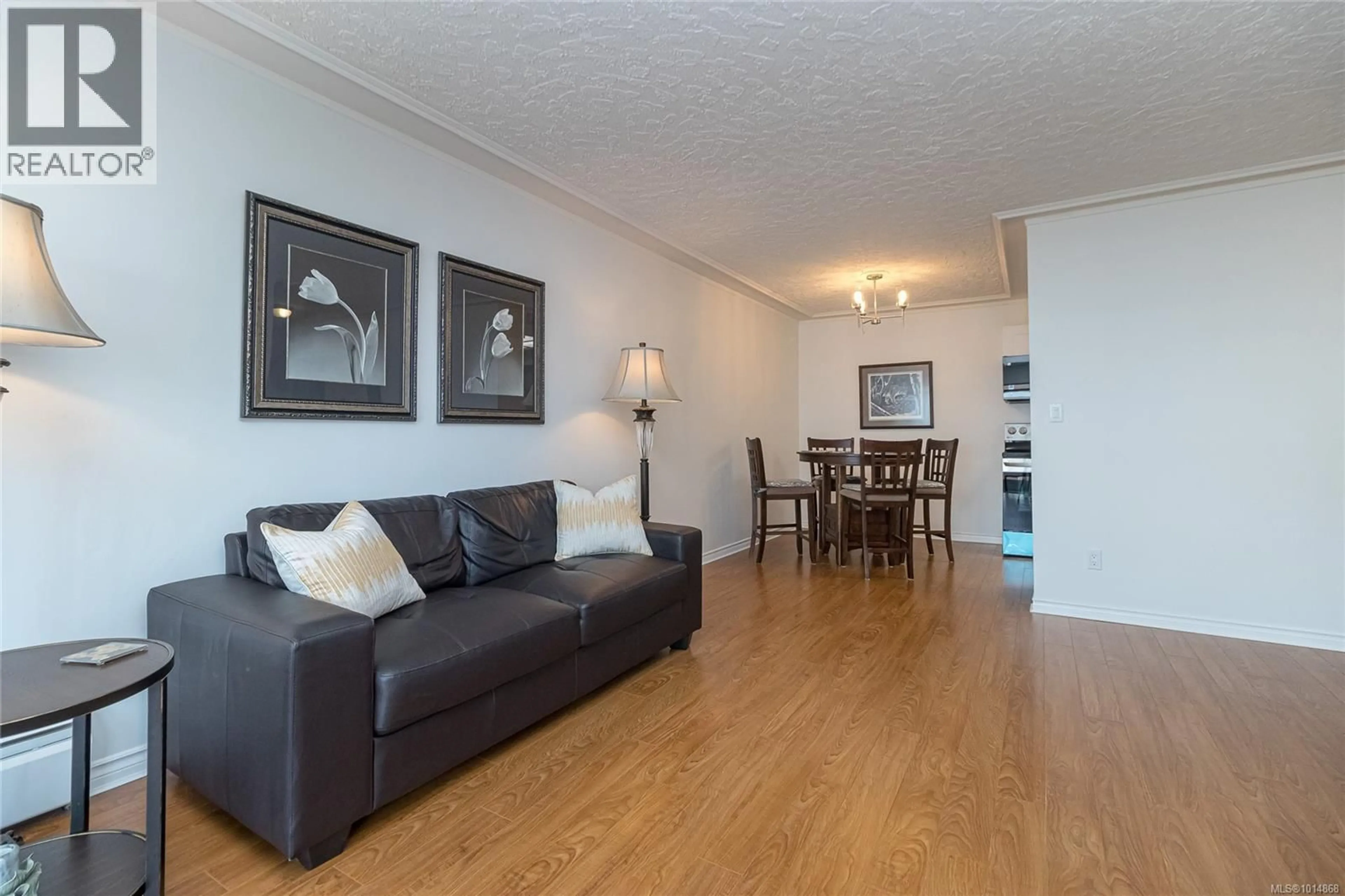 Living room with furniture, wood/laminate floor for 211 - 9560 FIFTH STREET, Sidney British Columbia V8L2W5