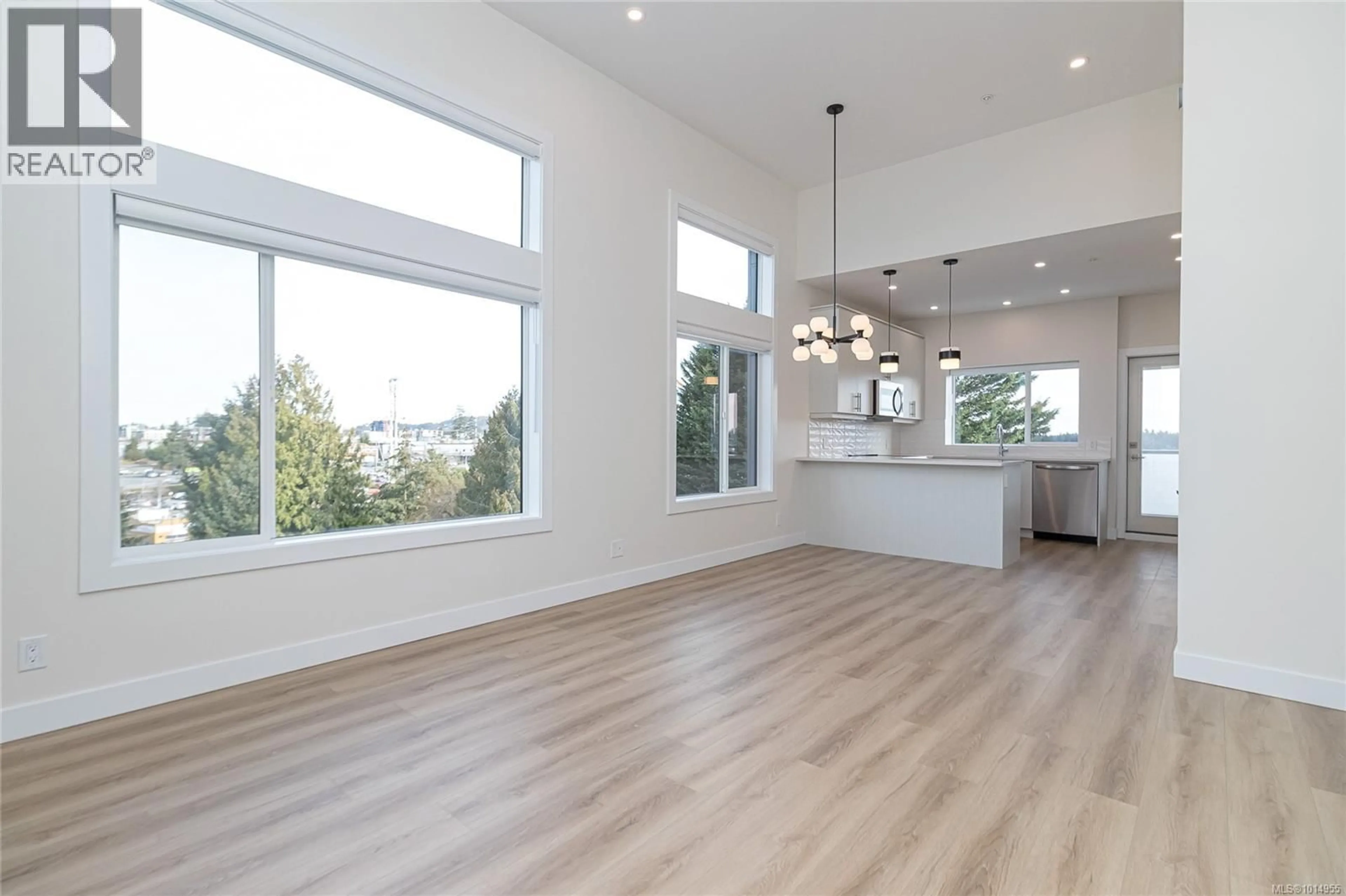 Open concept kitchen, wood/laminate floor for 506 - 918 JENKINS AVENUE, Langford British Columbia V9B2N7
