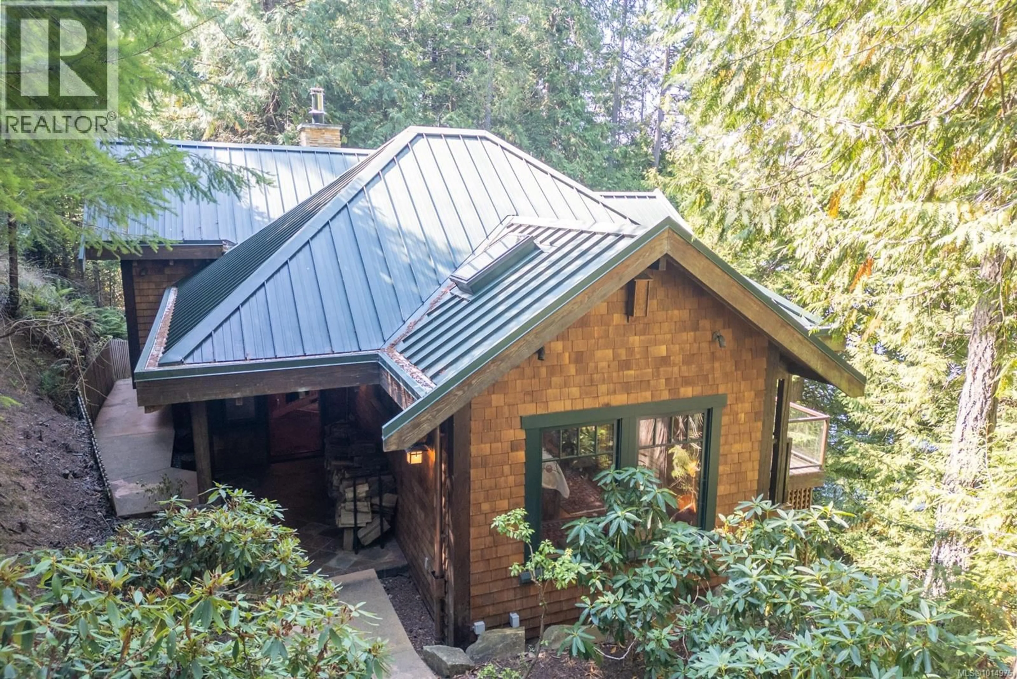 A pic from outside/outdoor area/front of a property/back of a property/a pic from drone, forest/trees view for 8807 AINSLIE POINT ROAD, Pender Island British Columbia V0N2M3