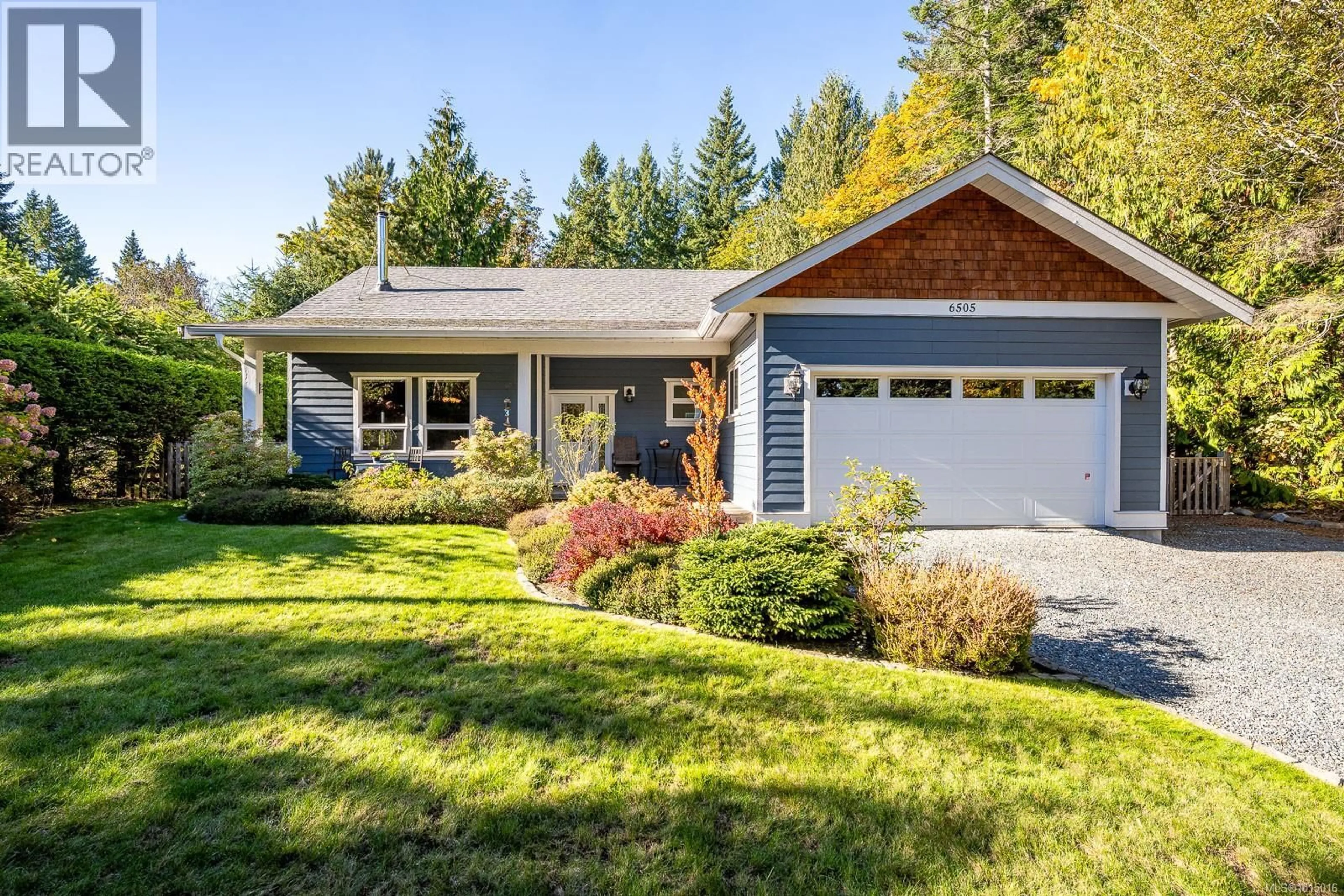Home with vinyl exterior material, street for 6505 MYSTERY BEACH ROAD, Fanny Bay British Columbia V0R1W0