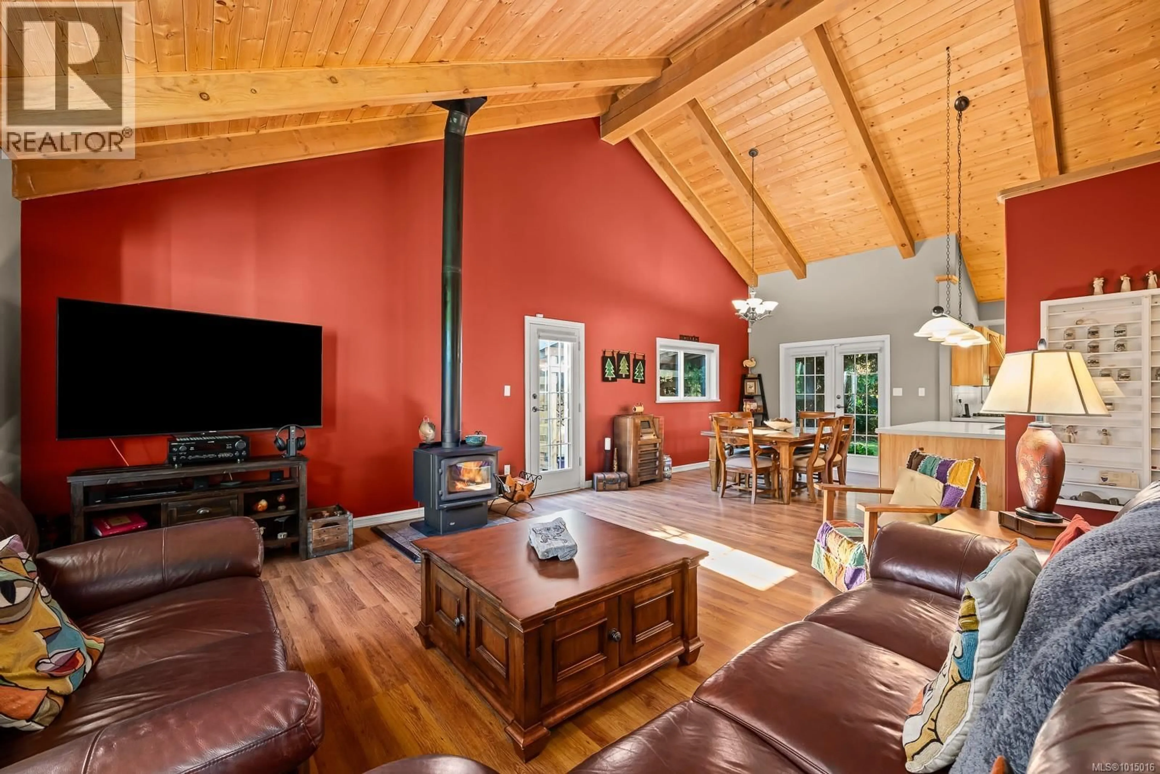Living room with furniture, wood/laminate floor for 6505 MYSTERY BEACH ROAD, Fanny Bay British Columbia V0R1W0