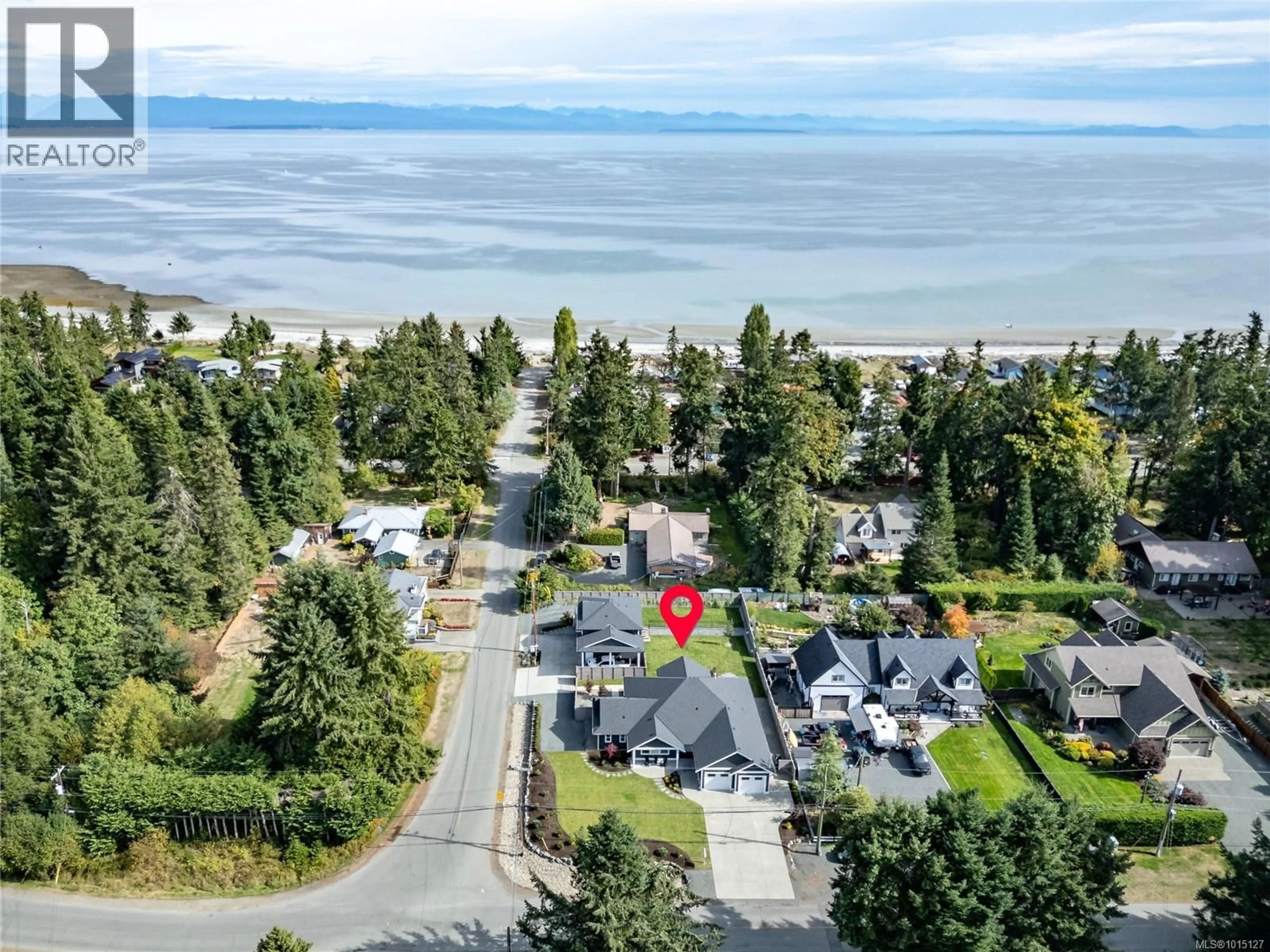 A pic from outside/outdoor area/front of a property/back of a property/a pic from drone, water/lake/river/ocean view for 8968 HENDERSON AVENUE, Black Creek British Columbia V9J1A4