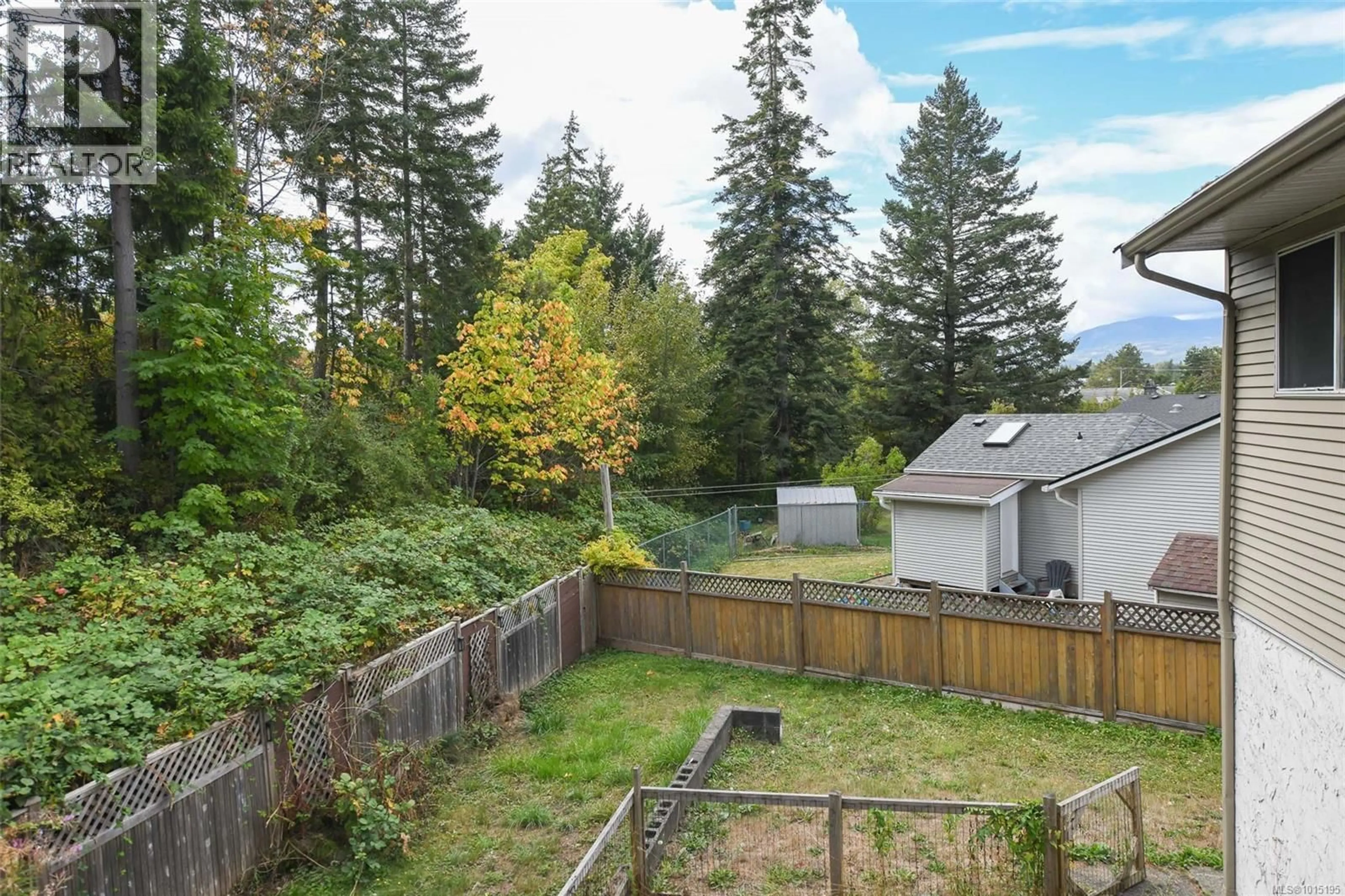A pic from outside/outdoor area/front of a property/back of a property/a pic from drone, forest/trees view for 1571 VALLEY CRESCENT, Courtenay British Columbia V9N3W2