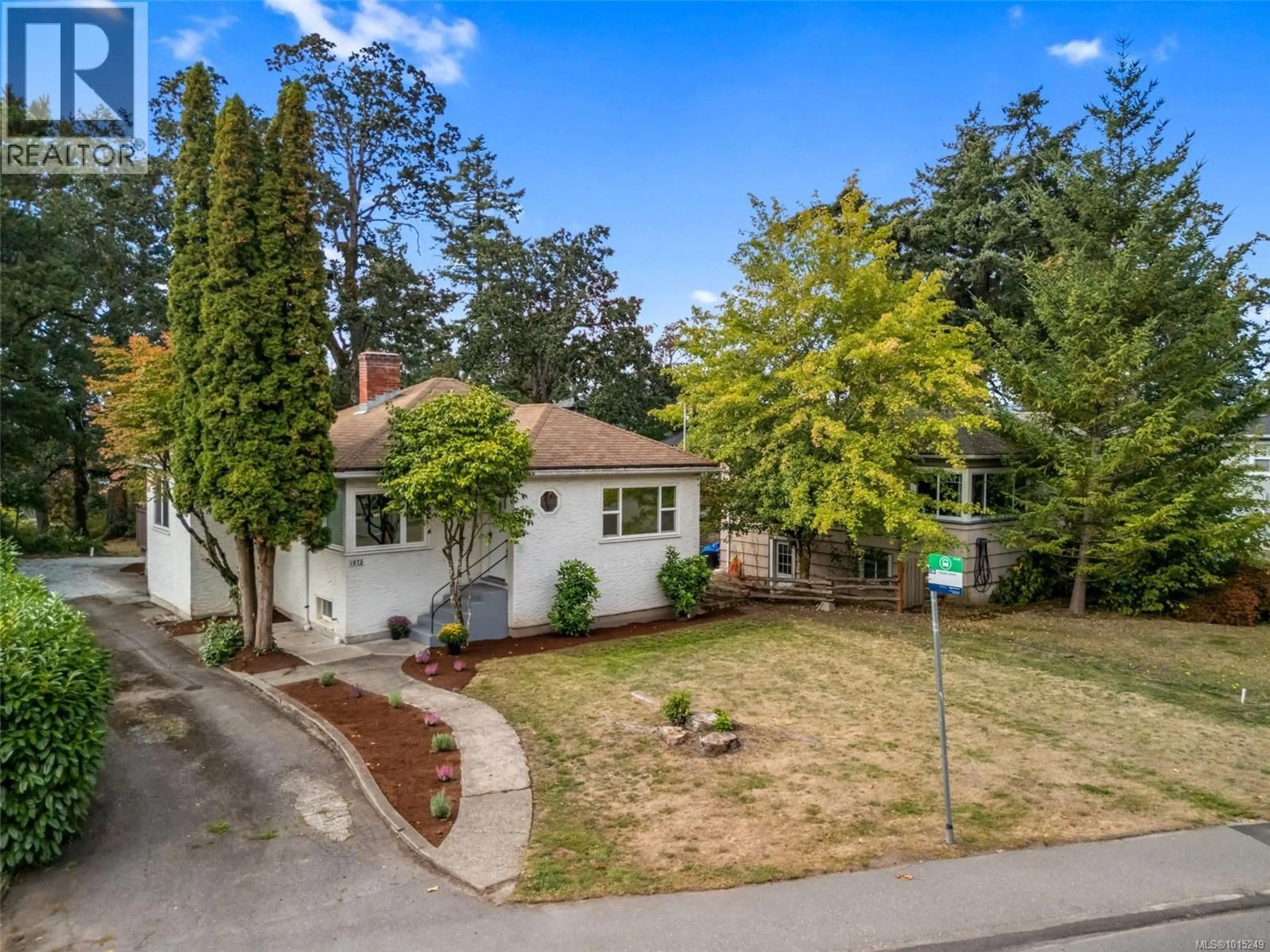 A pic from outside/outdoor area/front of a property/back of a property/a pic from drone, street for 1075 BURNSIDE ROAD WEST, Saanich British Columbia V8Z1N4