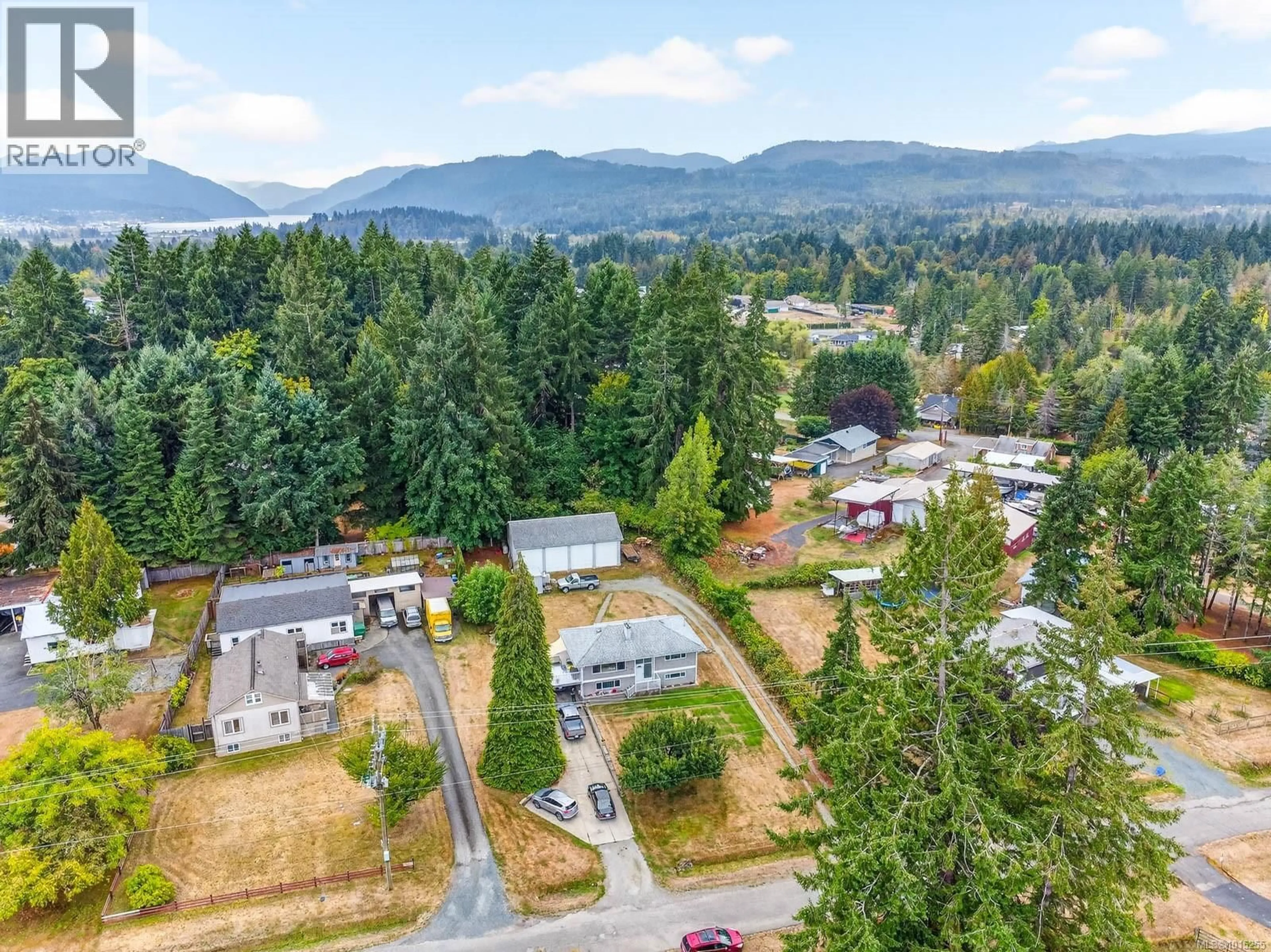 A pic from outside/outdoor area/front of a property/back of a property/a pic from drone, mountain view for 5660 GORDON AVENUE, Port Alberni British Columbia V9Y8W3