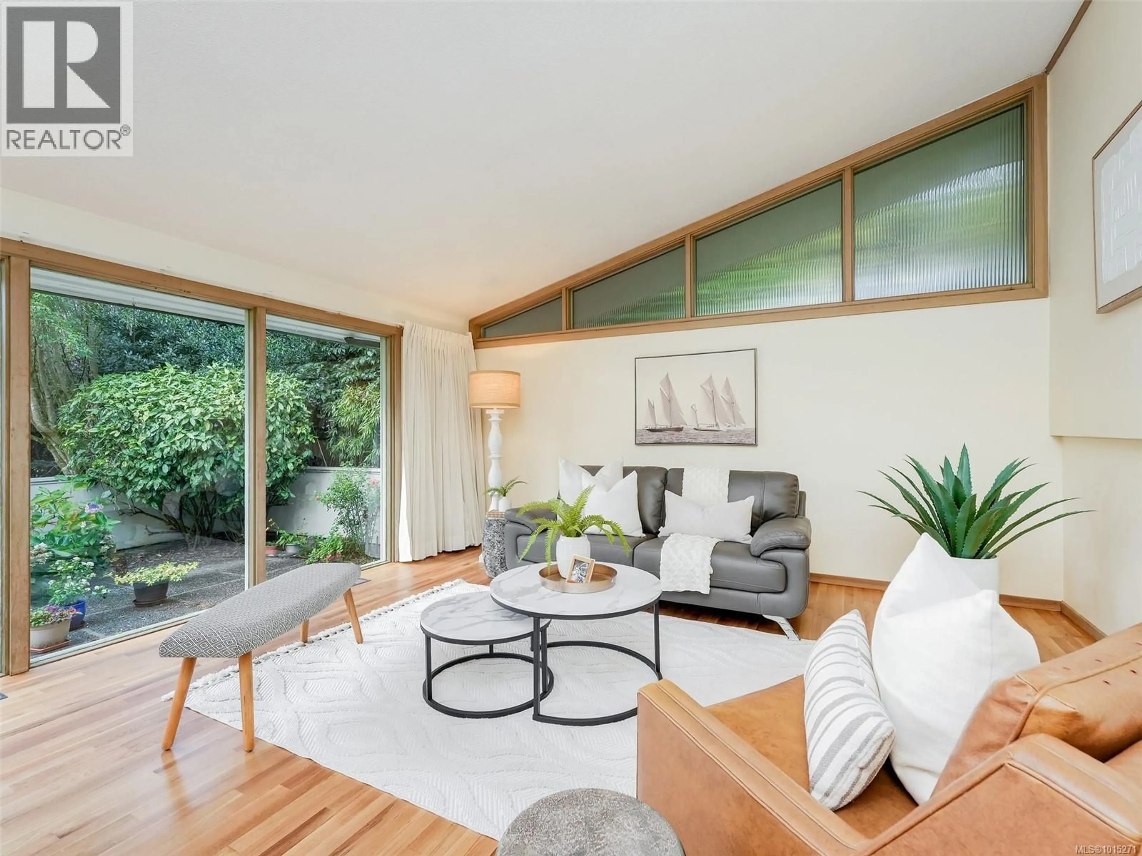 Living room with furniture, wood/laminate floor for 1676 ST. FRANCIS WOOD, Victoria British Columbia V8X1X6