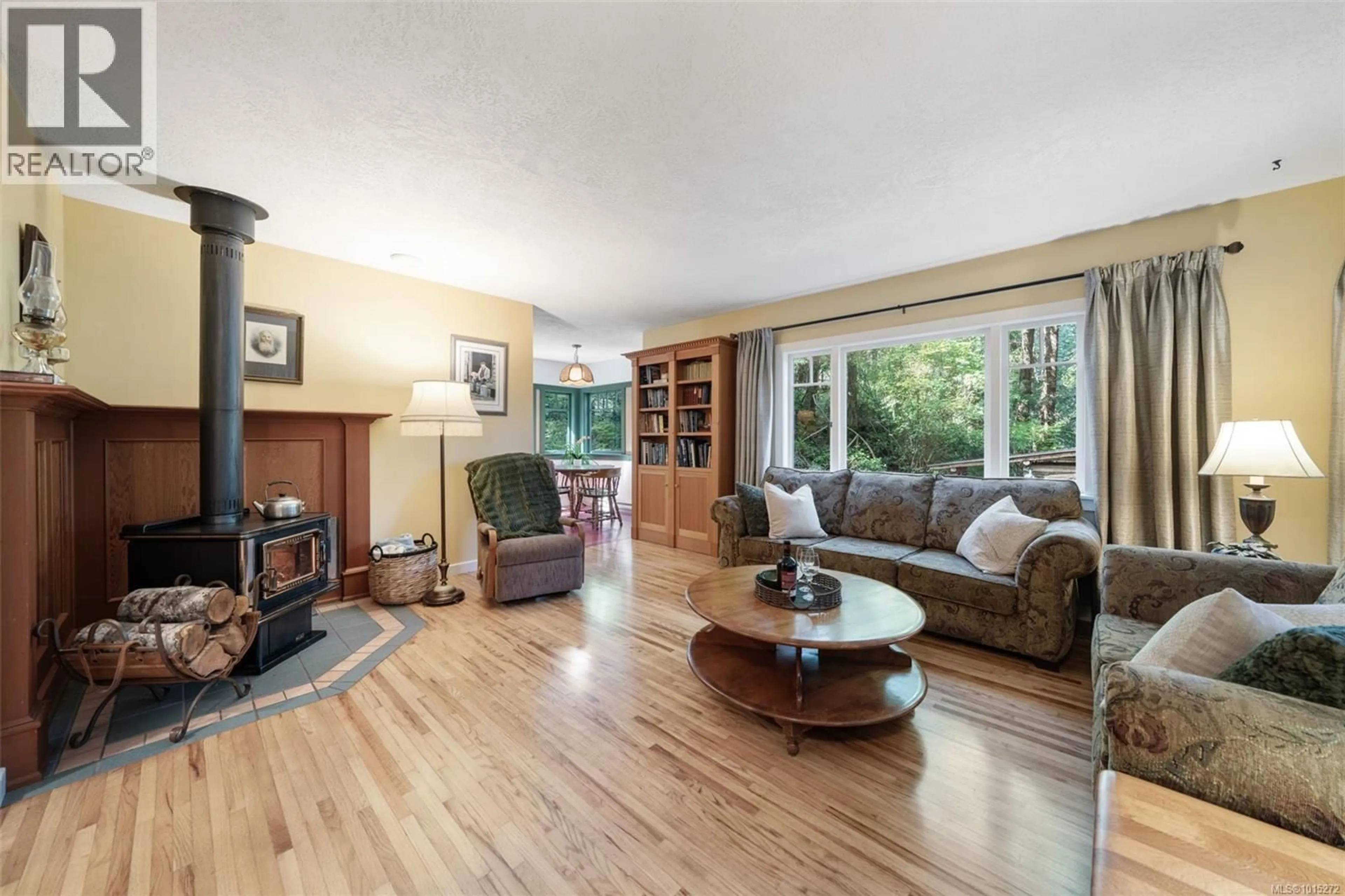 Living room with furniture, wood/laminate floor for 2295 KING ROAD, Sooke British Columbia V9Z0K7
