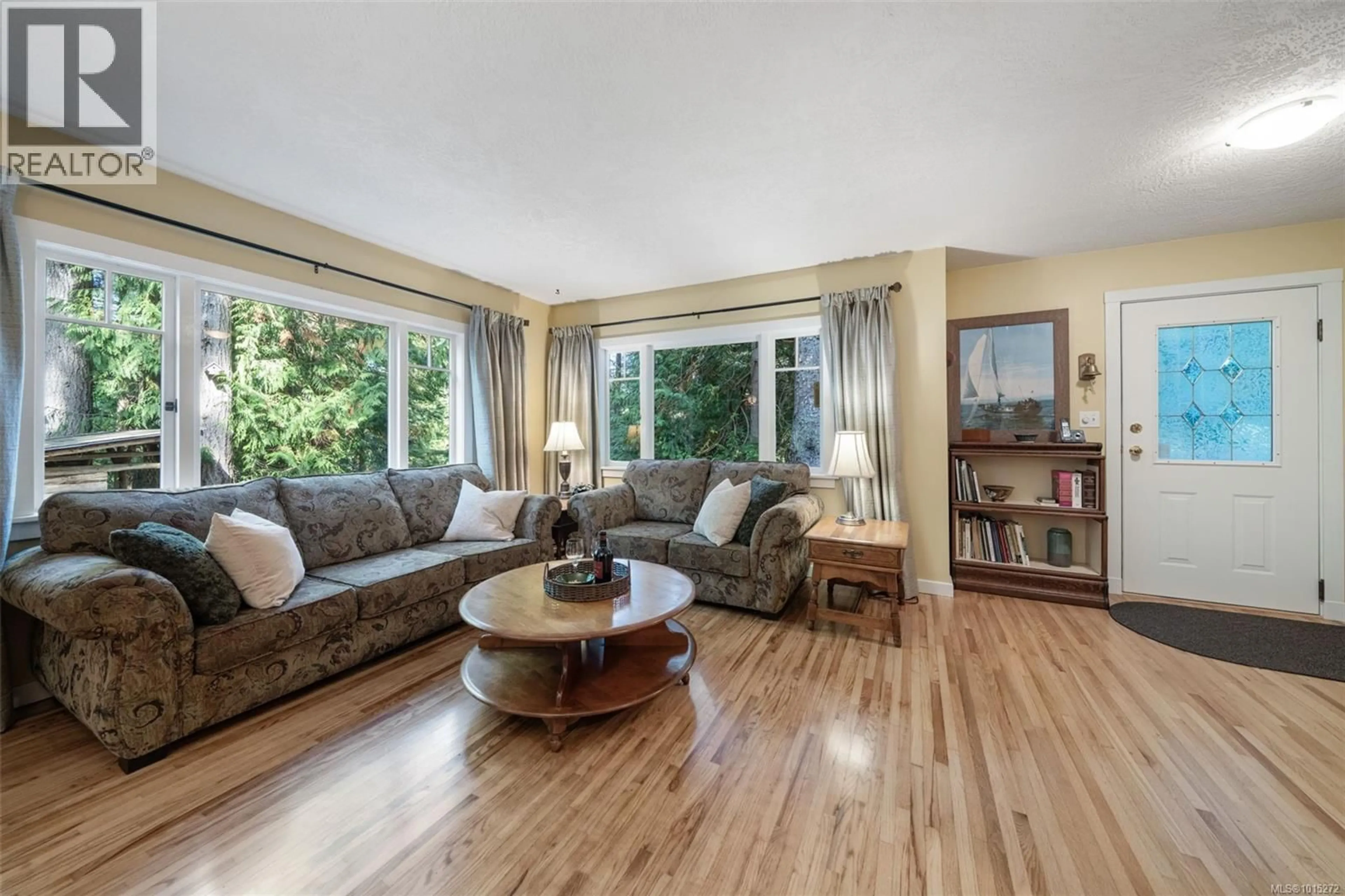 Living room with furniture, wood/laminate floor for 2295 KING ROAD, Sooke British Columbia V9Z0K7