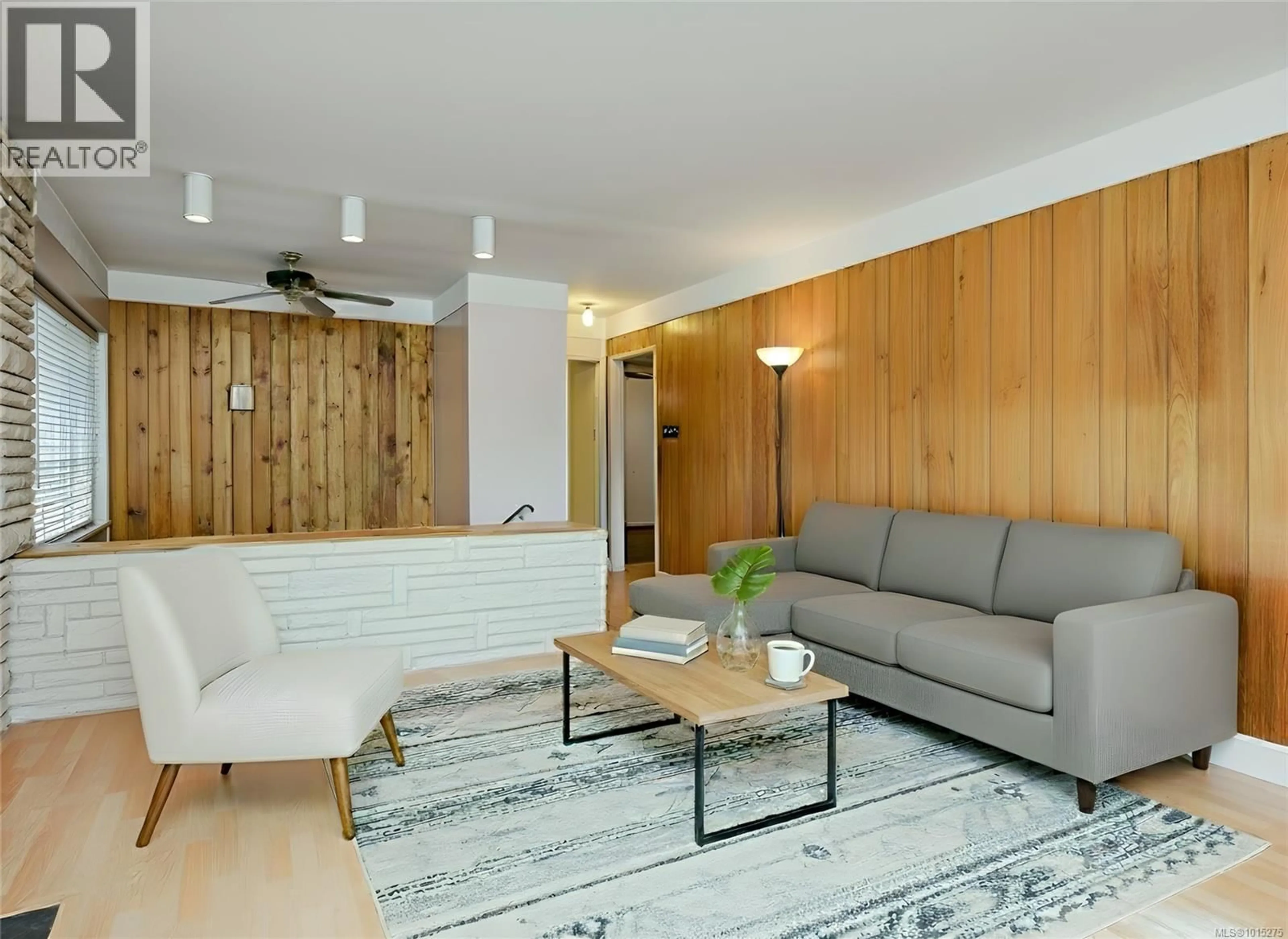 Living room with furniture, wood/laminate floor for 970 AMBASSADOR AVENUE, Saanich British Columbia V8X3N2