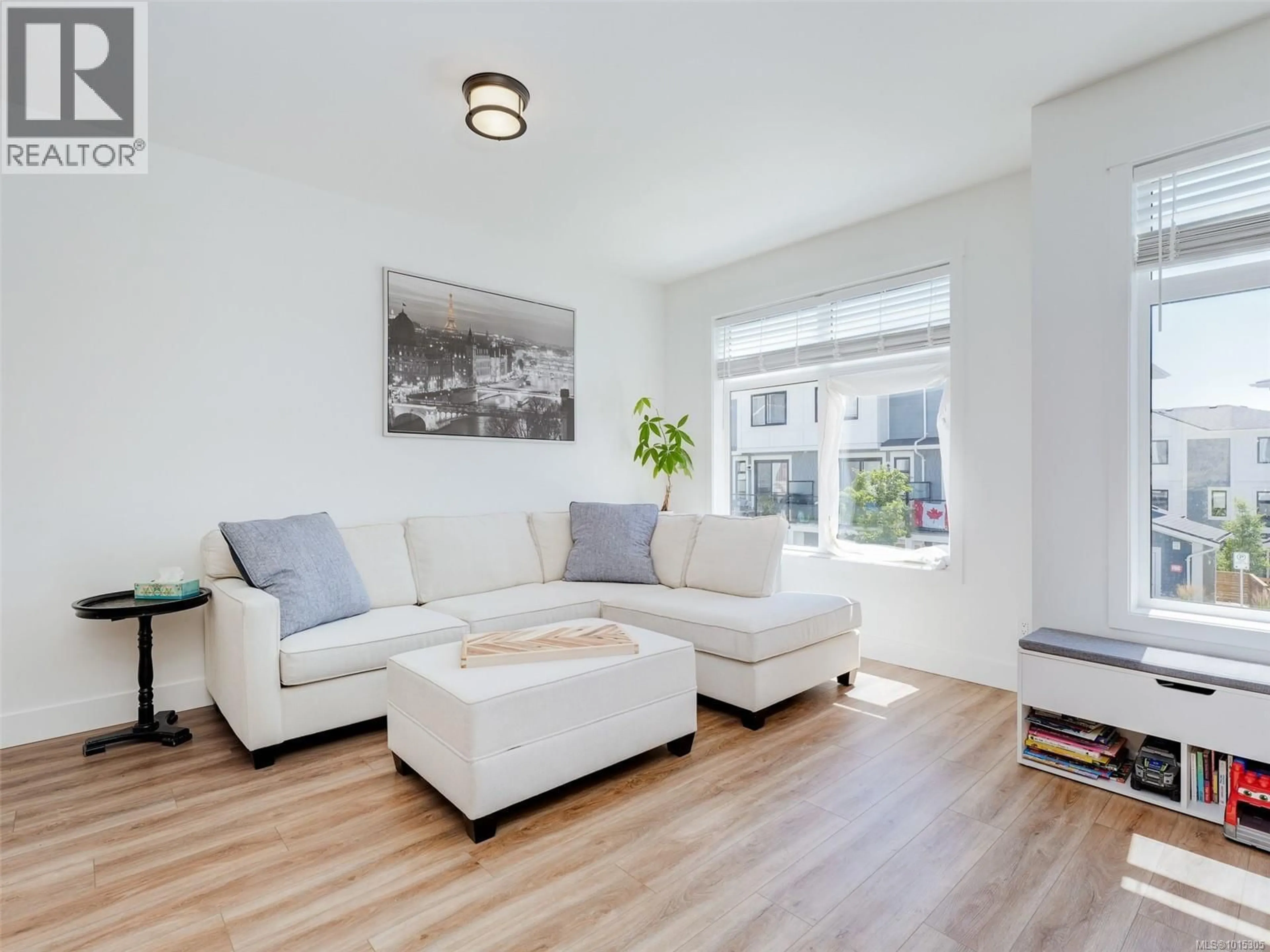 Living room with furniture, wood/laminate floor for 21 - 255 CASPIAN DRIVE, Colwood British Columbia V9C0R9