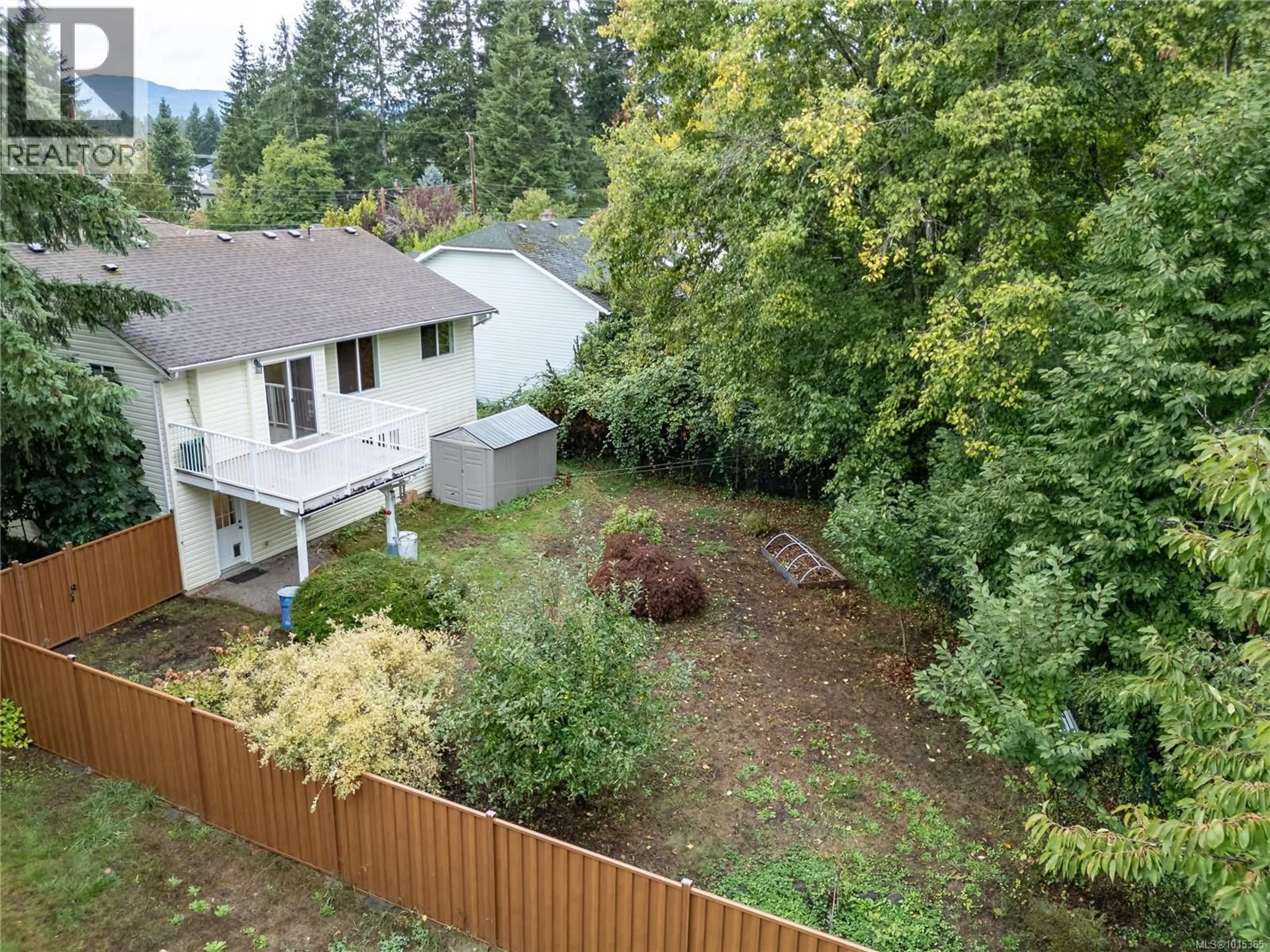 A pic from outside/outdoor area/front of a property/back of a property/a pic from drone, forest/trees view for 1520 EMBLETON CRESCENT, Courtenay British Columbia V9N6N8