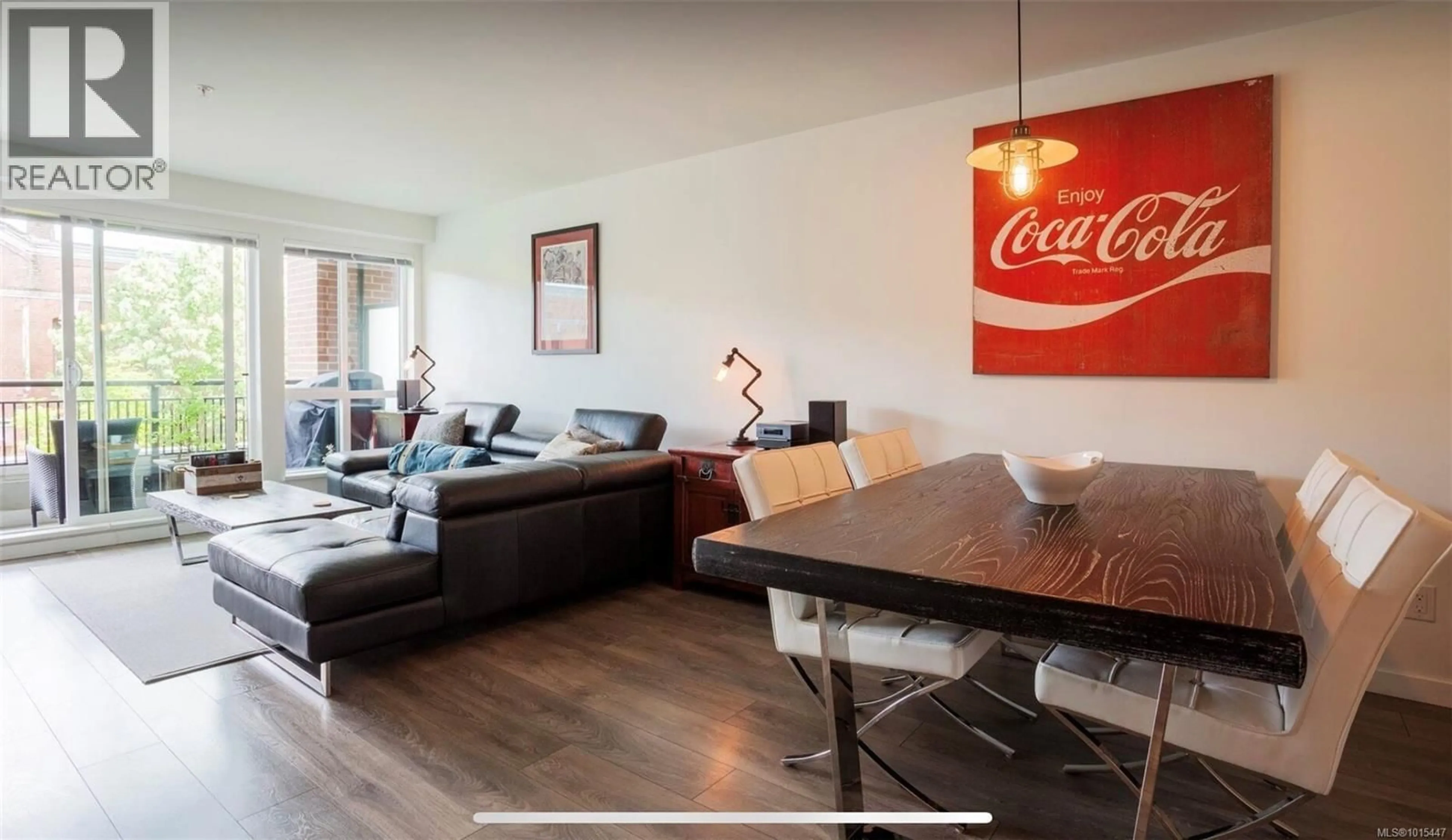Living room with furniture, wood/laminate floor for 212 - 528 PANDORA AVENUE, Victoria British Columbia V8W0C6