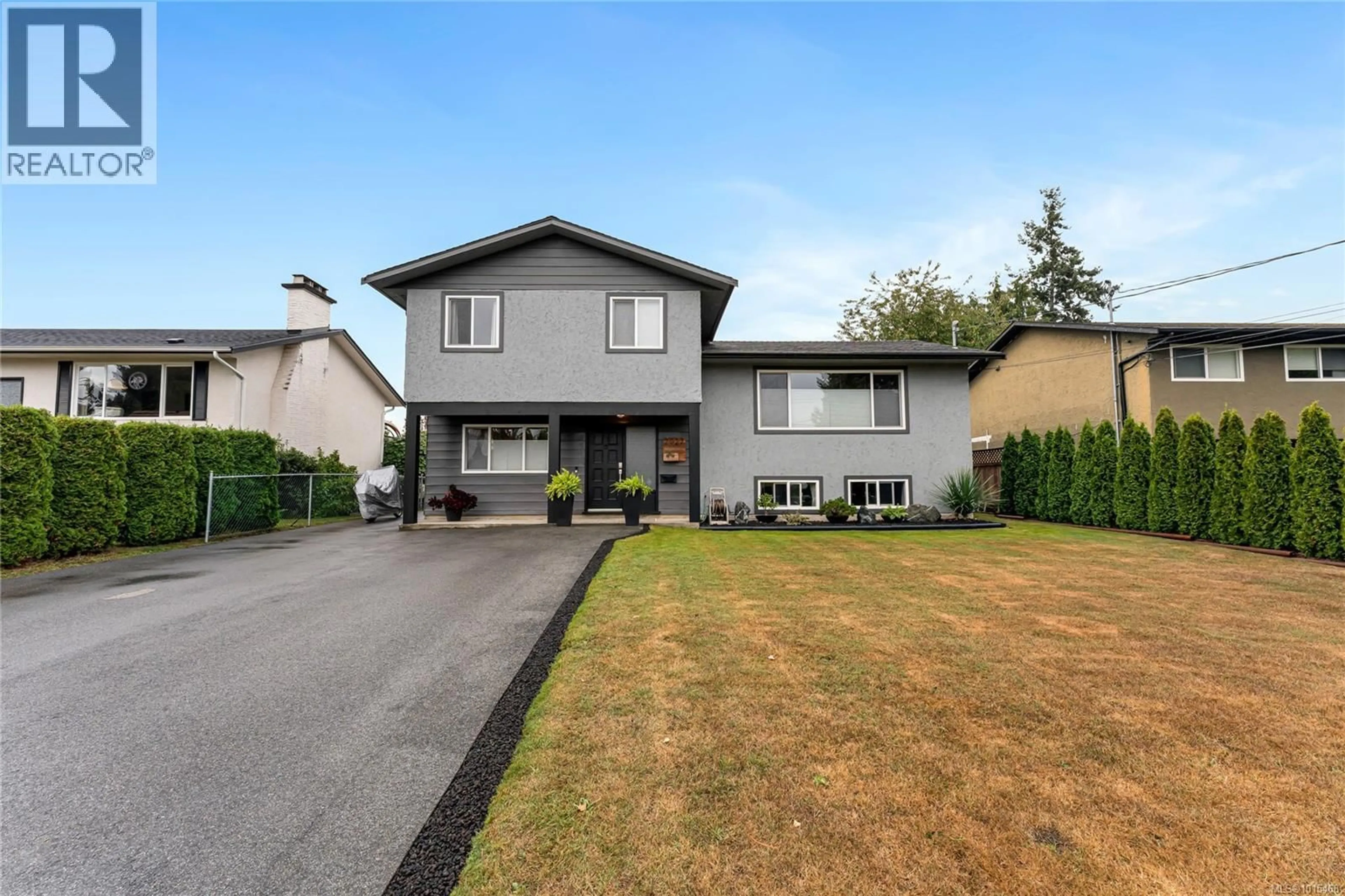 Home with vinyl exterior material, street for 2027 ARDWELL AVENUE, Sidney British Columbia V8L2L6