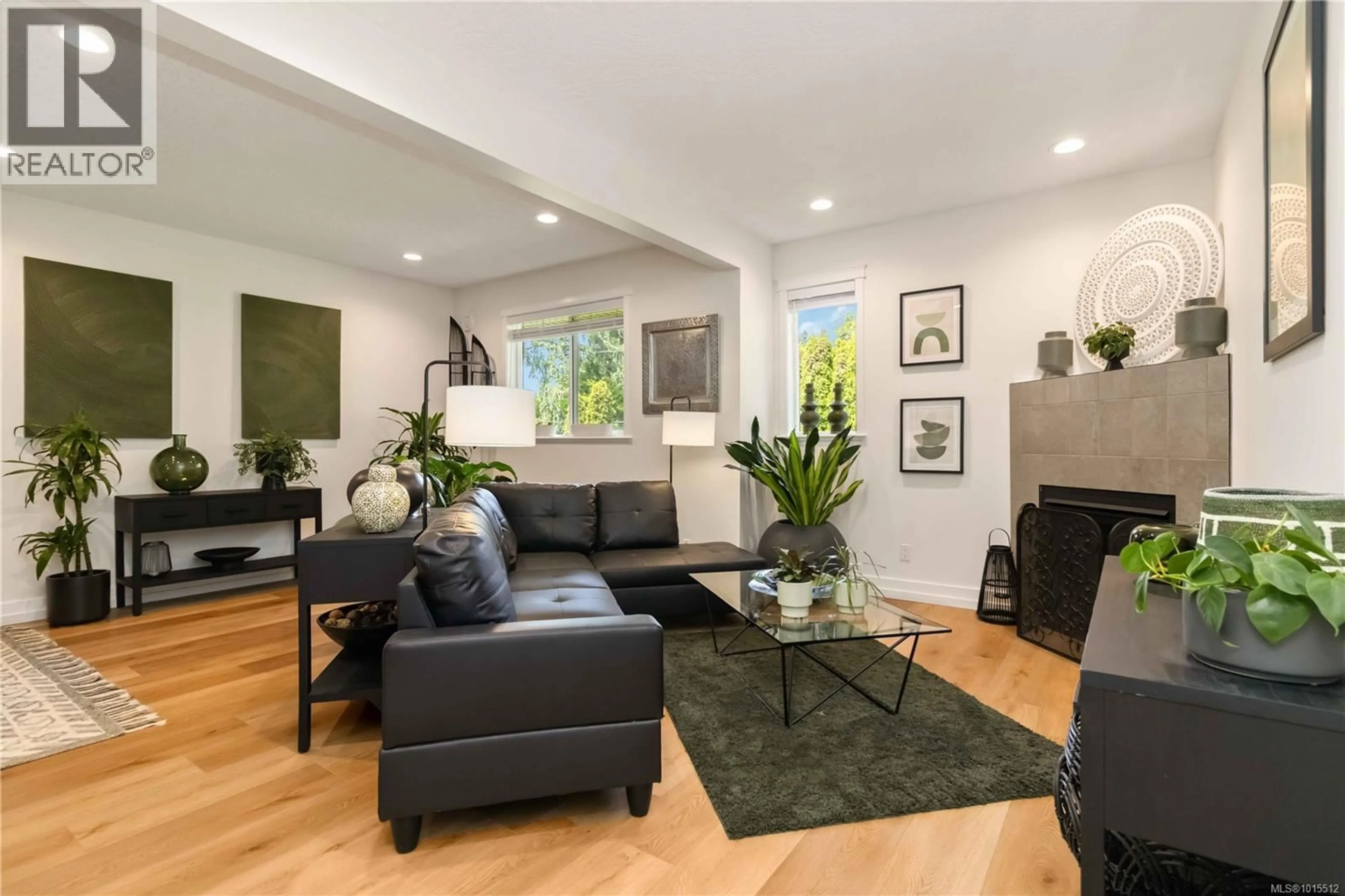 Living room with furniture, wood/laminate floor for 107 - 1924 MAPLE AVENUE SOUTH, Sooke British Columbia V9Z1J8