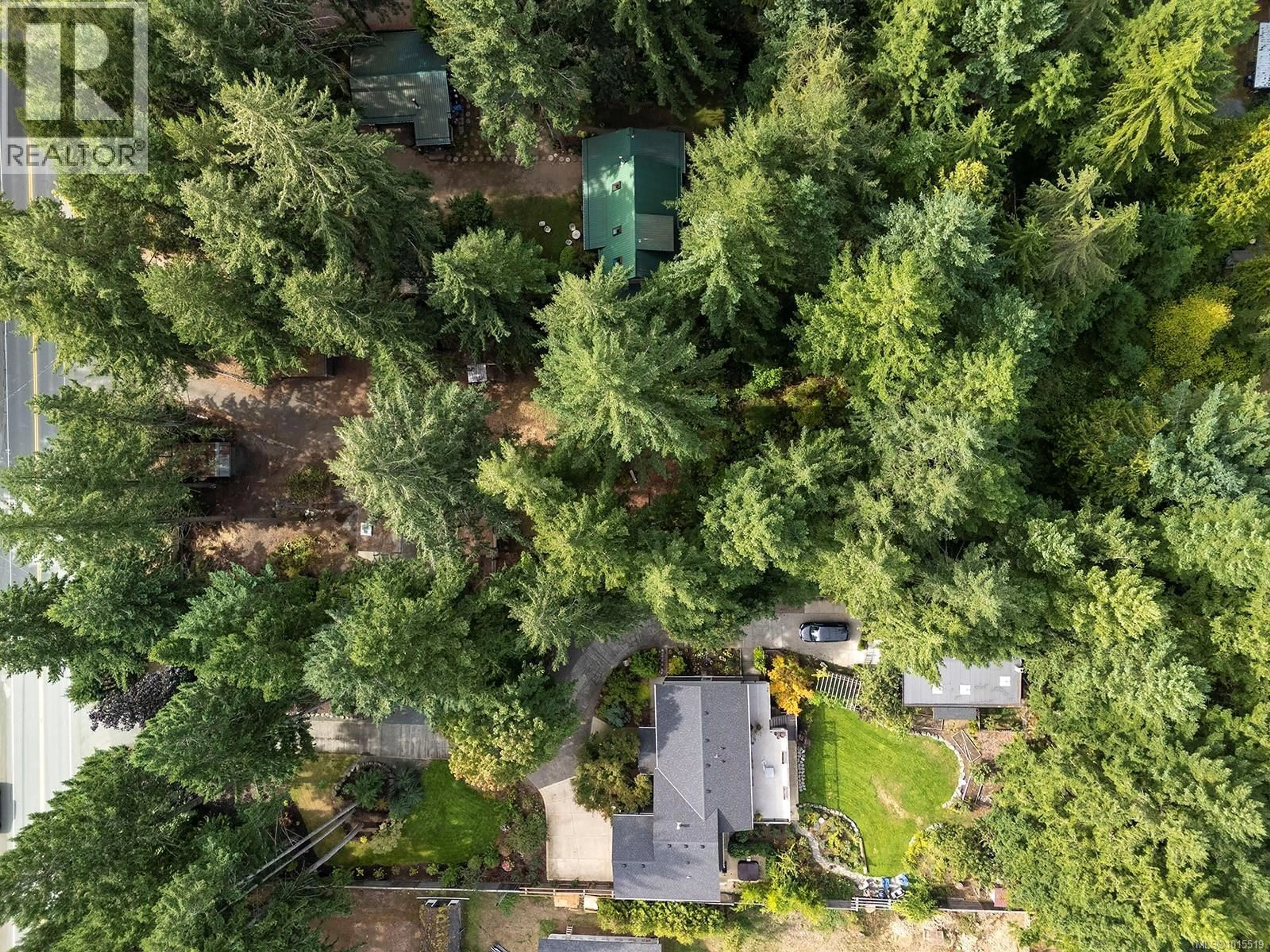 A pic from outside/outdoor area/front of a property/back of a property/a pic from drone, forest/trees view for 1912 RYAN ROAD EAST, Comox British Columbia V9M4C9