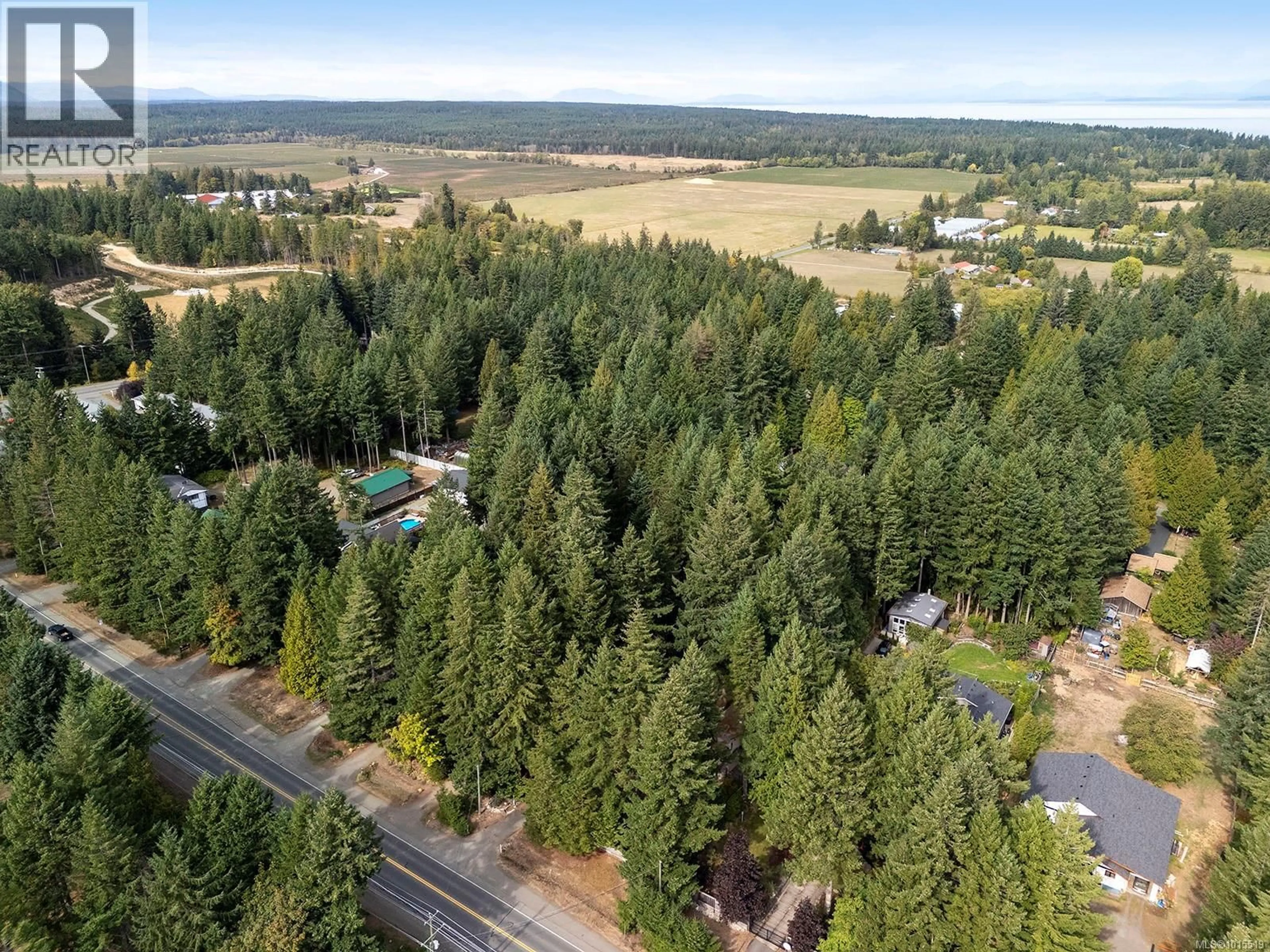 A pic from outside/outdoor area/front of a property/back of a property/a pic from drone, forest/trees view for 1912 RYAN ROAD EAST, Comox British Columbia V9M4C9