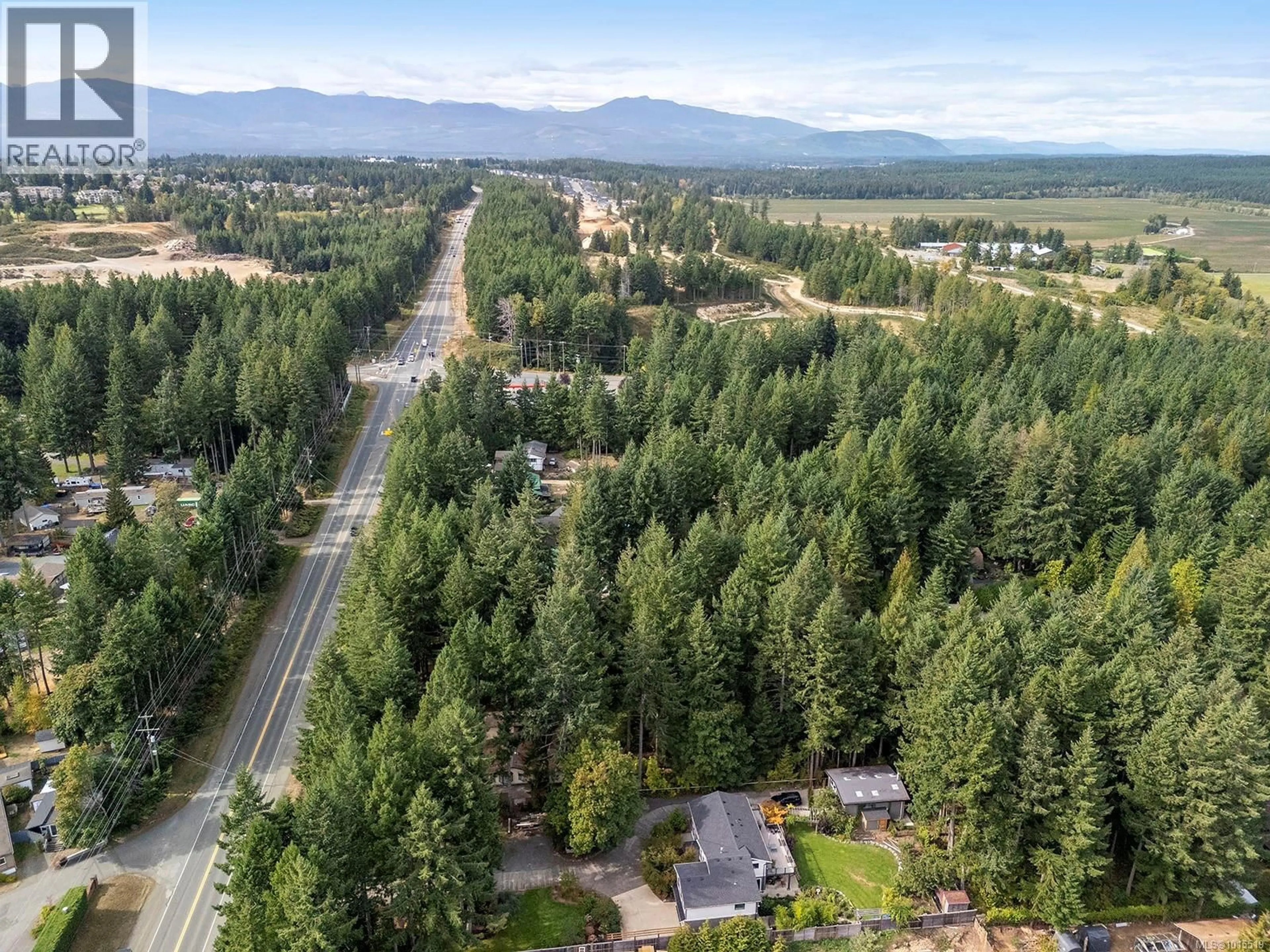 A pic from outside/outdoor area/front of a property/back of a property/a pic from drone, forest/trees view for 1912 RYAN ROAD EAST, Comox British Columbia V9M4C9