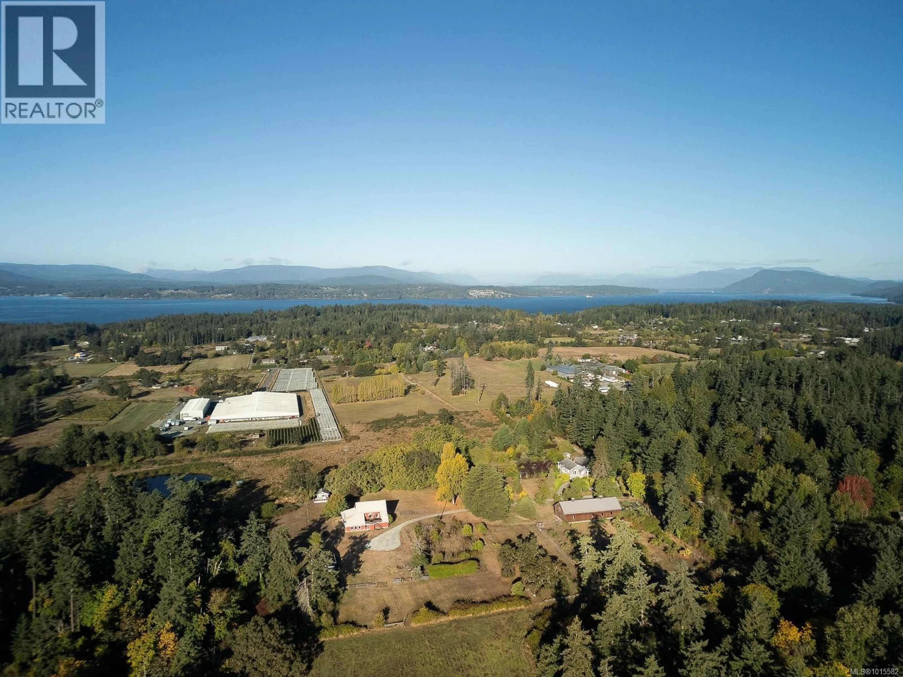 A pic from outside/outdoor area/front of a property/back of a property/a pic from drone, mountain view for 1175 WAIN ROAD, North Saanich British Columbia V8L5V1