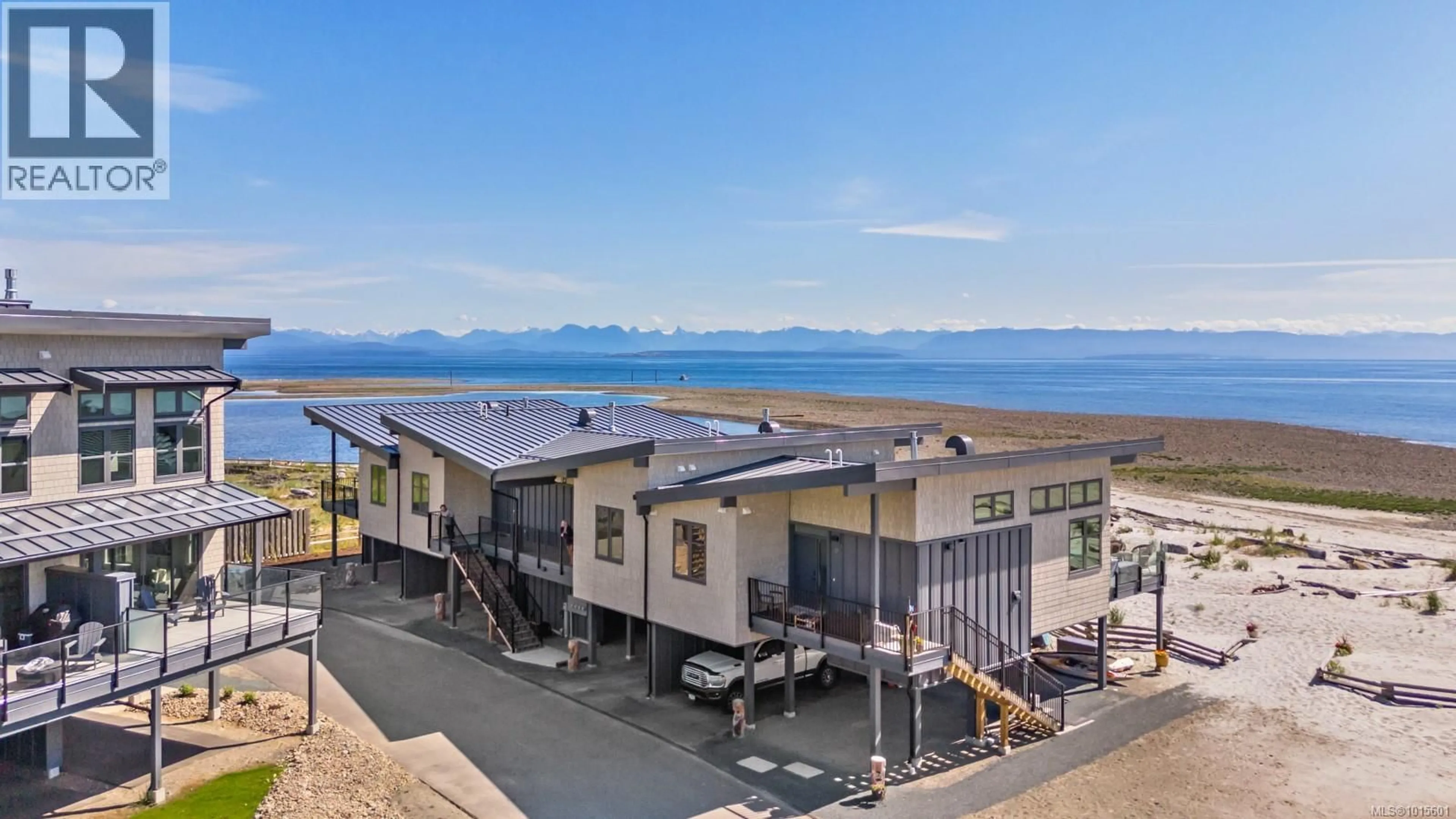 A pic from outside/outdoor area/front of a property/back of a property/a pic from drone, water/lake/river/ocean view for 12 - 9022 CLARKSON AVENUE, Black Creek British Columbia V9J1B2