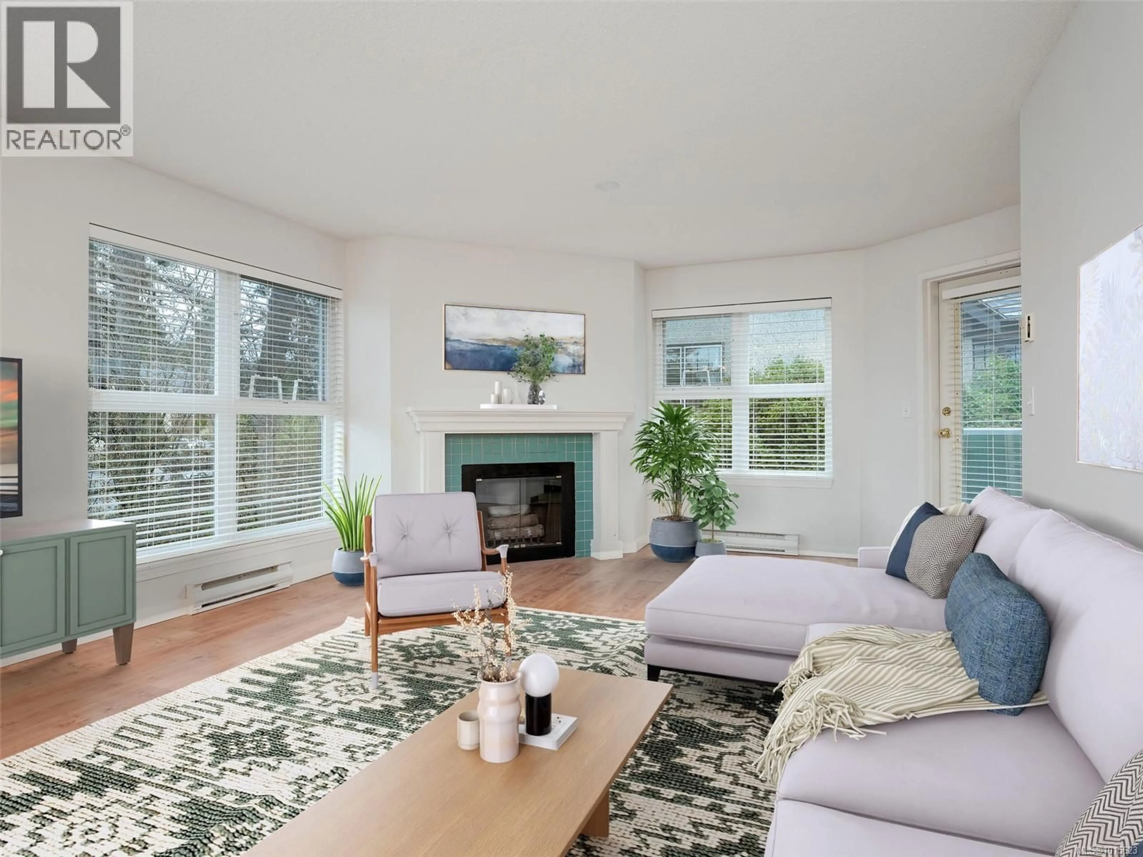 Living room with furniture, wood/laminate floor for 302 - 1201 HILLSIDE AVENUE, Victoria British Columbia V8T2B1