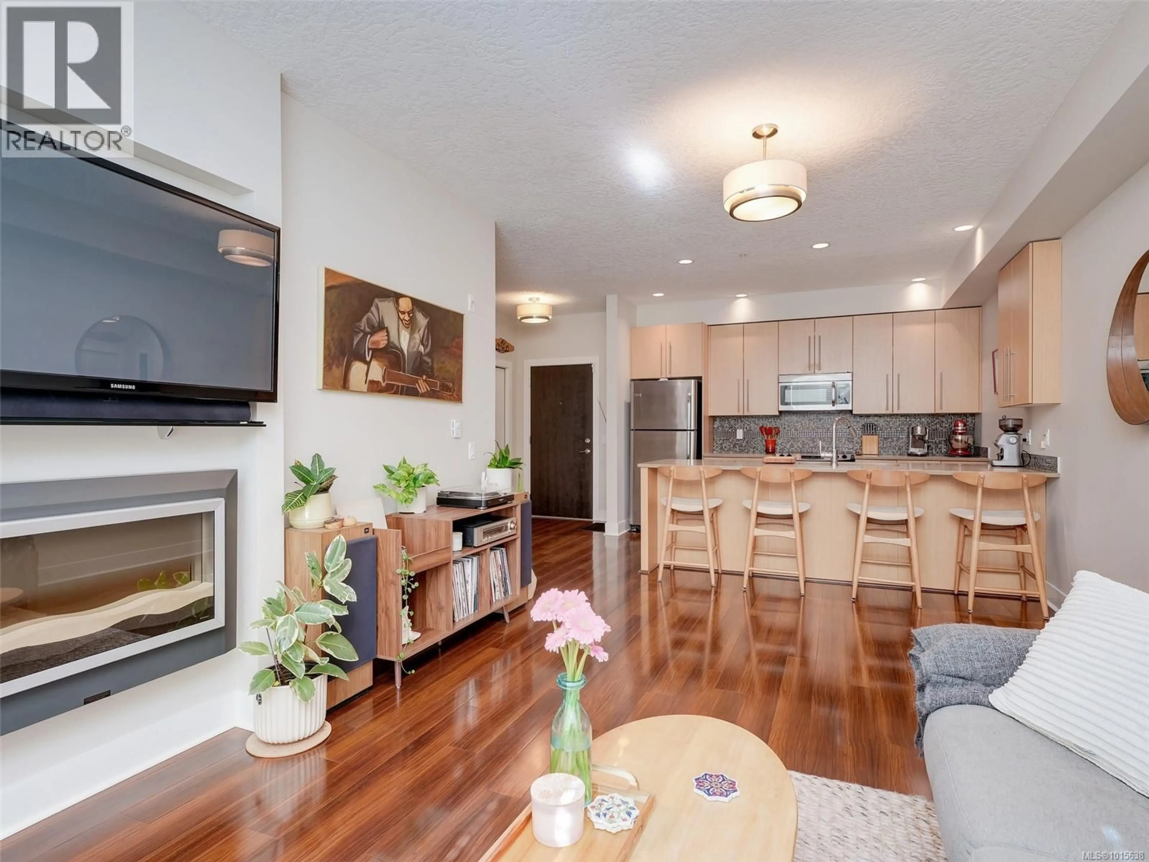 Open concept kitchen, wood/laminate floor for 207 - 4529 WEST SAANICH ROAD, Saanich British Columbia V8Z3G3