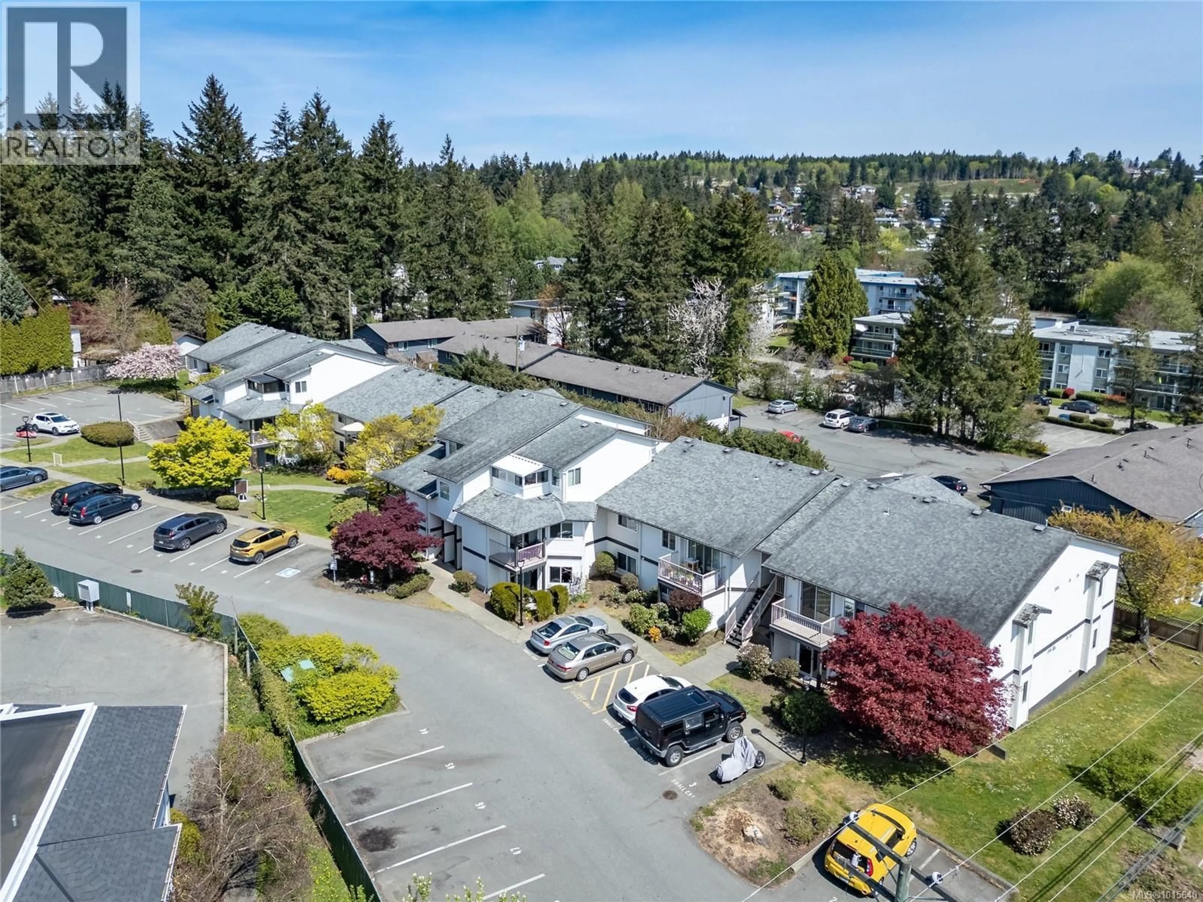 A pic from outside/outdoor area/front of a property/back of a property/a pic from drone, street for 206 - 146 BACK ROAD, Courtenay British Columbia V9N3W6