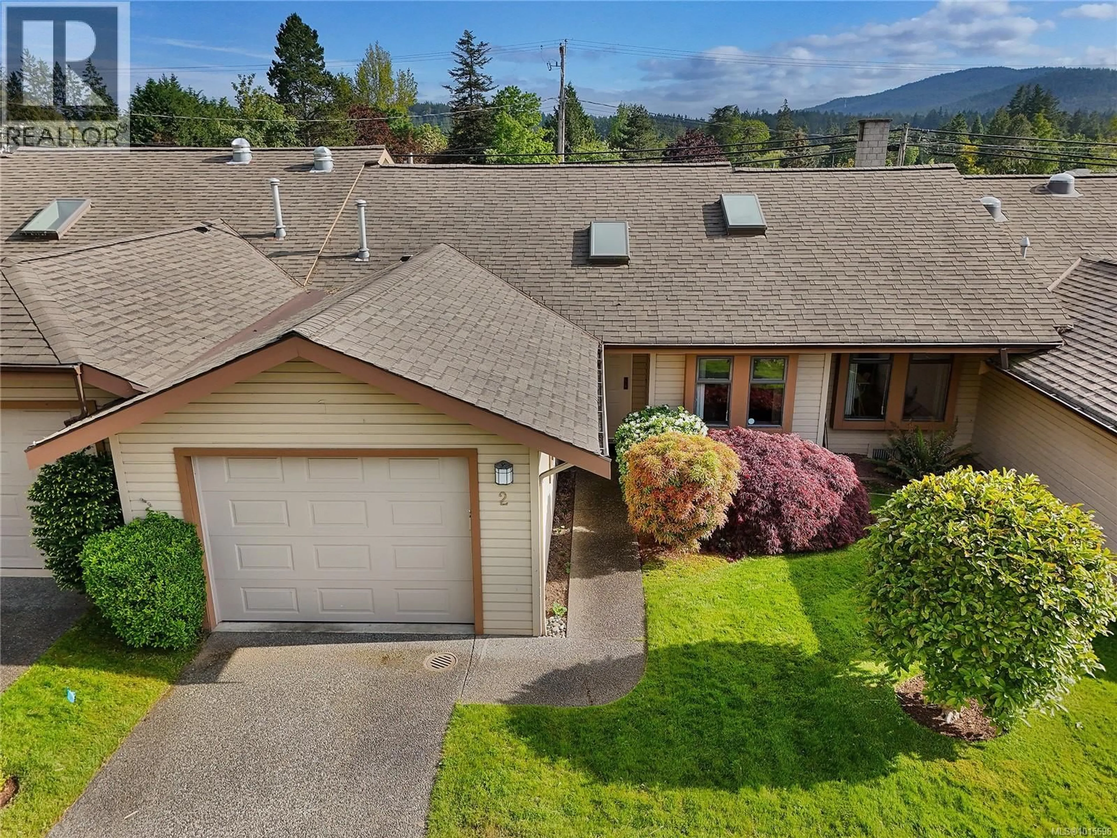 A pic from outside/outdoor area/front of a property/back of a property/a pic from drone, mountain view for 2 - 1144 VERDIER AVENUE, Central Saanich British Columbia V8M1K2