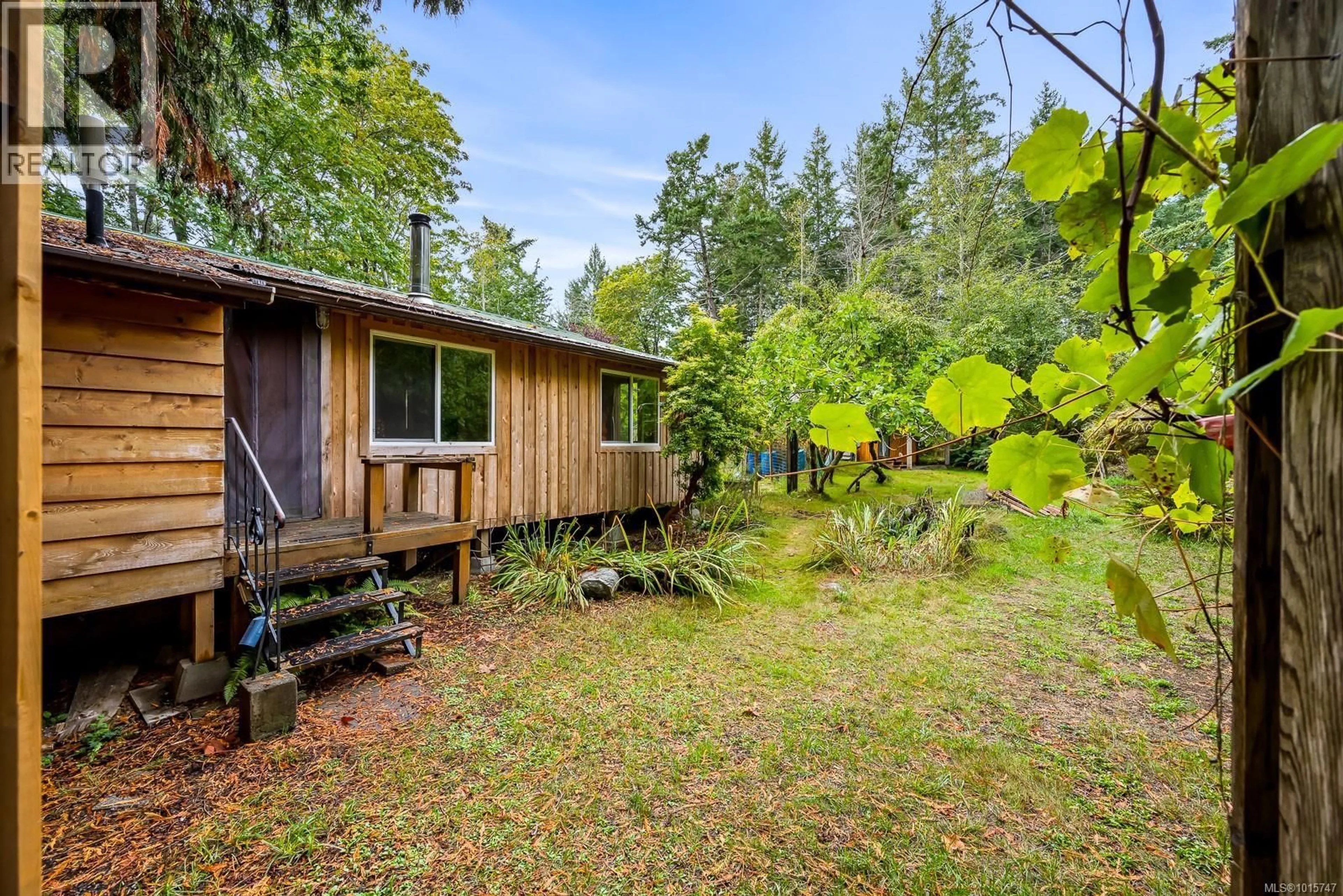 Patio, forest/trees view for 5450 SEAWRIGHT ROAD, Hornby Island British Columbia V0R1Z0