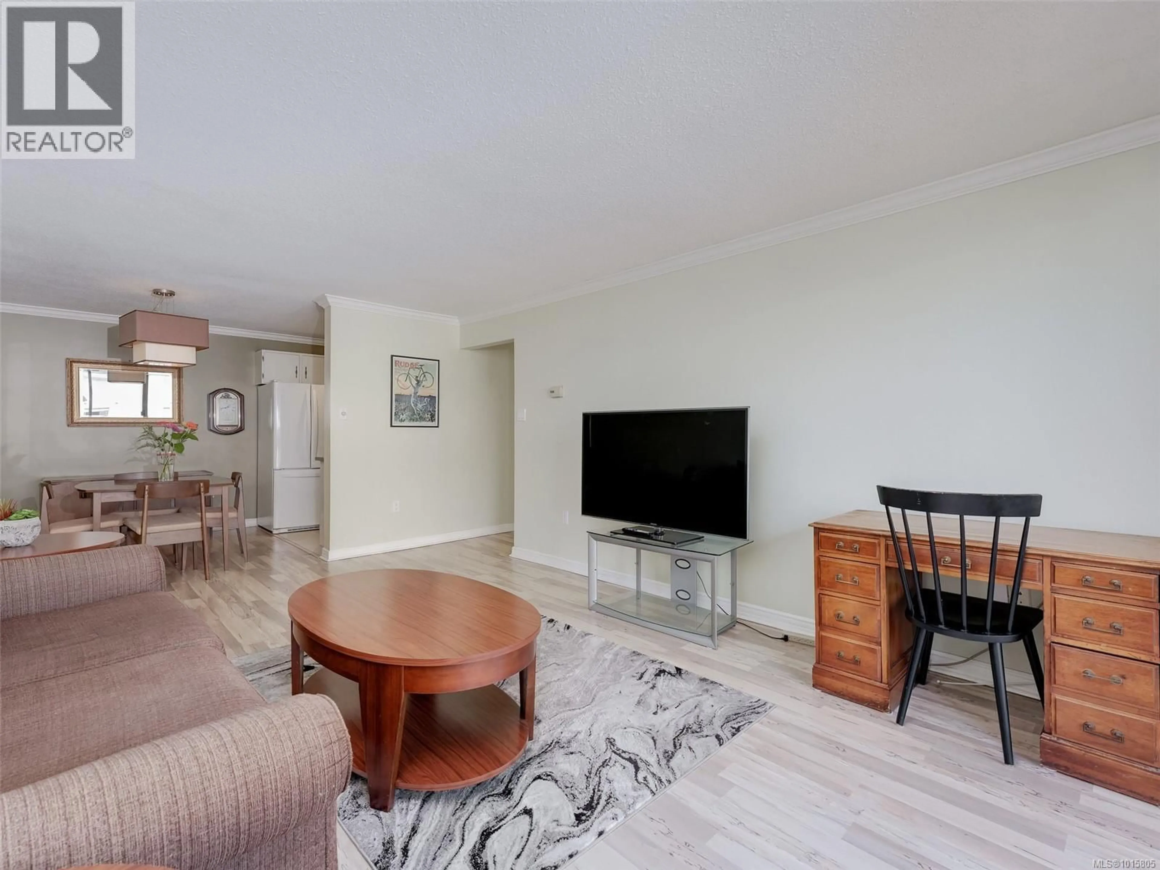 Living room with furniture, wood/laminate floor for 604 - 777 BLANSHARD STREET, Victoria British Columbia V8W2G9