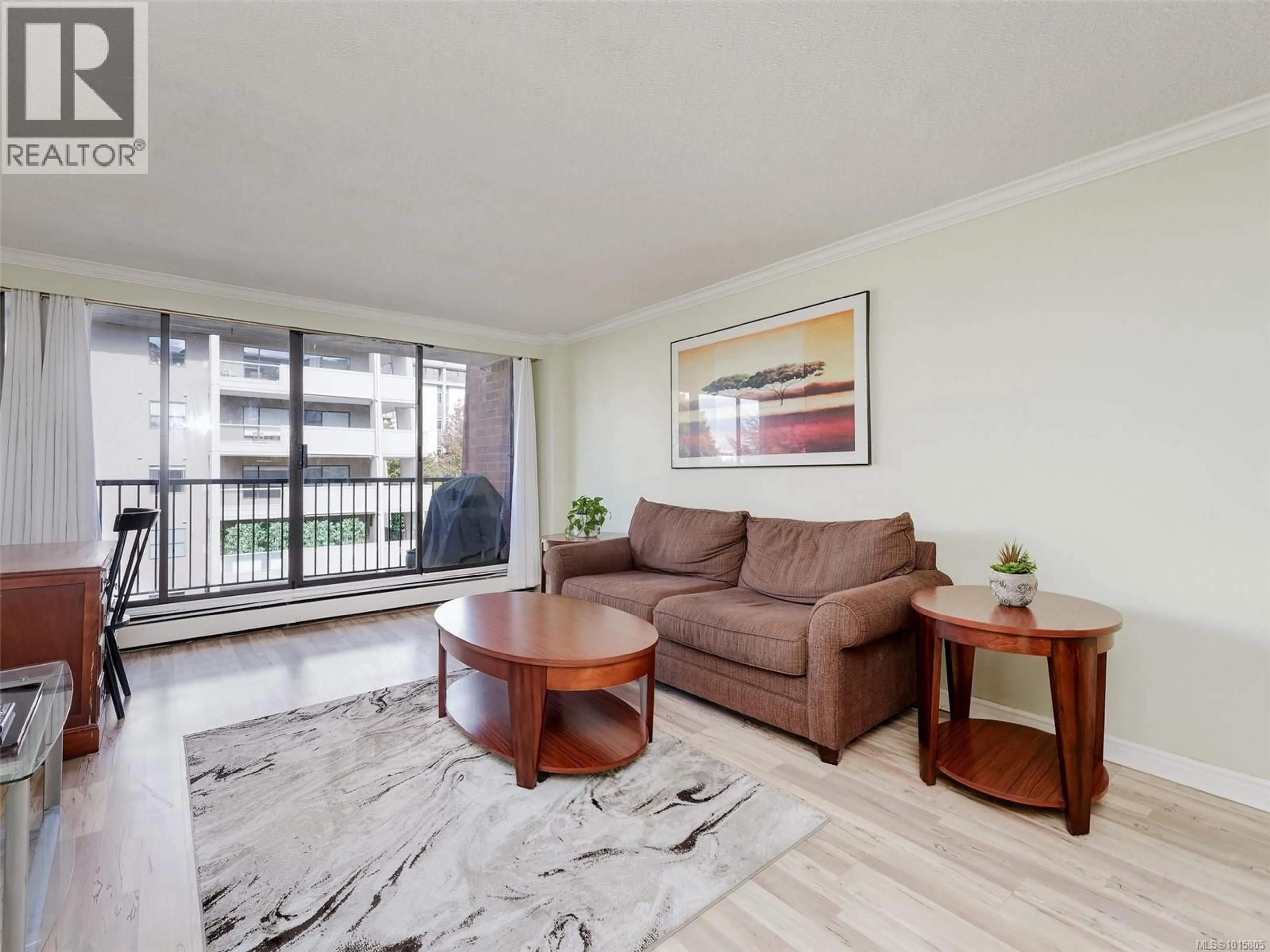Living room with furniture, wood/laminate floor for 604 - 777 BLANSHARD STREET, Victoria British Columbia V8W2G9