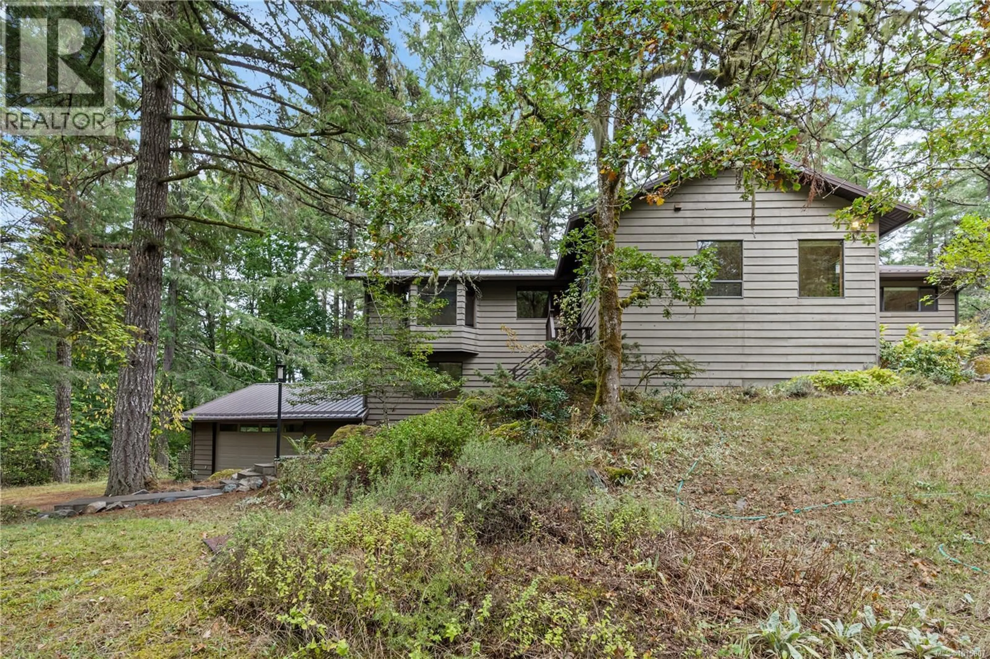 A pic from outside/outdoor area/front of a property/back of a property/a pic from drone, forest/trees view for 100 VIADUCT AVENUE WEST, Saanich British Columbia V9E1J3