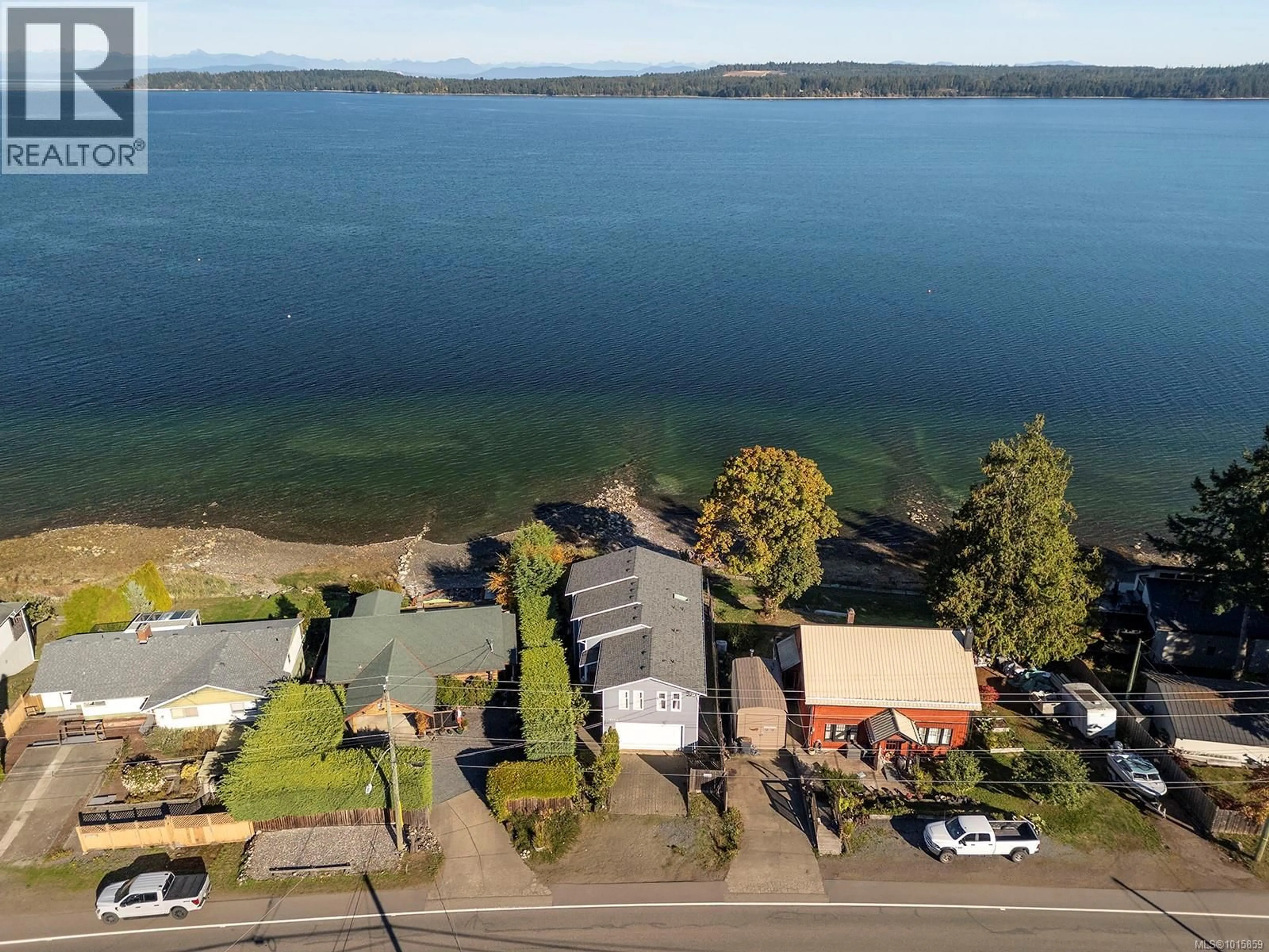 A pic from outside/outdoor area/front of a property/back of a property/a pic from drone, water/lake/river/ocean view for 5650 ISLAND HIGHWAY SOUTH, Union Bay British Columbia V0R3B0