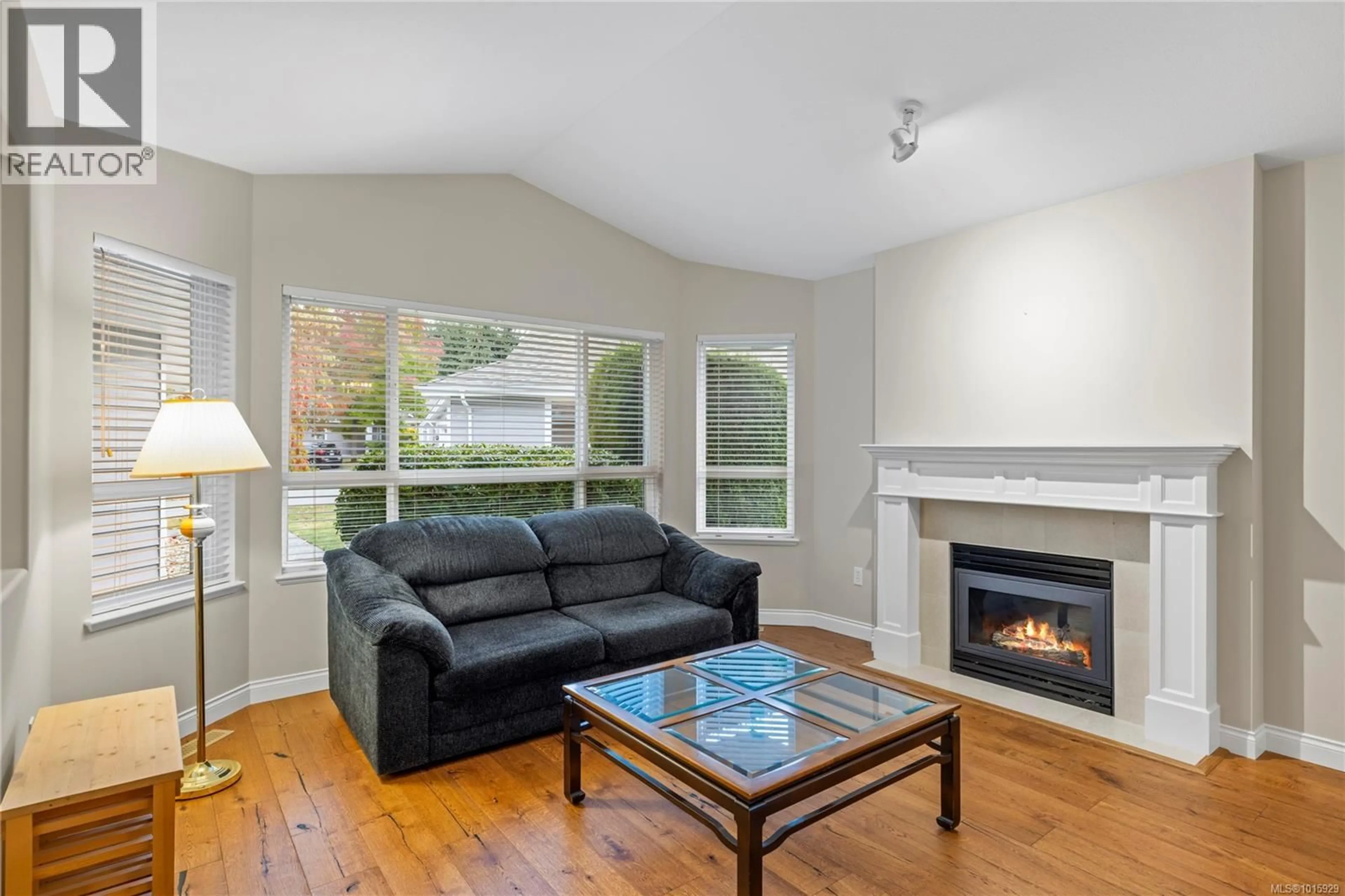Living room with furniture, wood/laminate floor for 1205 SATURNA DRIVE, Parksville British Columbia V9P2X5