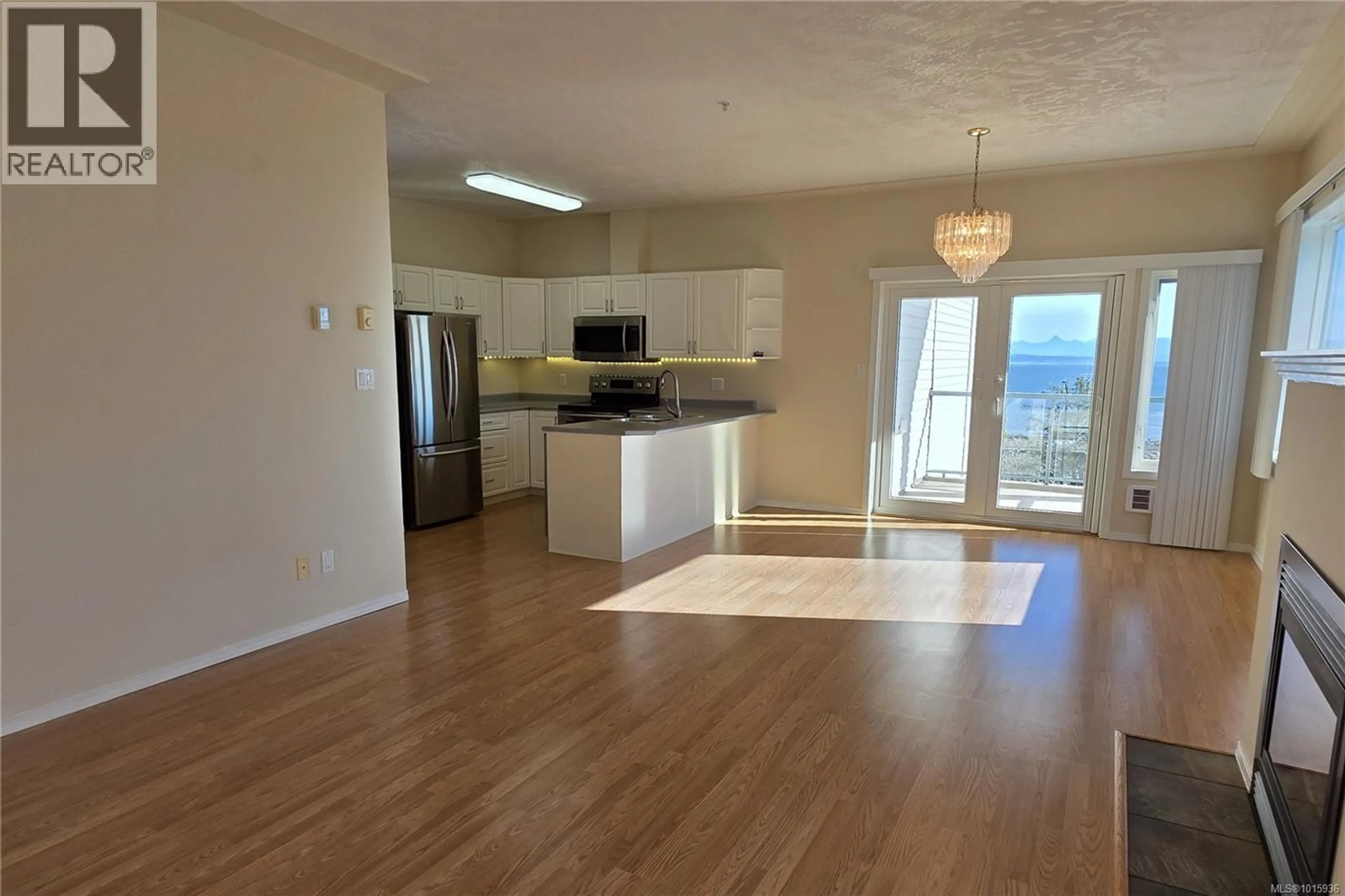 Open concept kitchen, wood/laminate floor for 301 - 1350 ISLAND HIGHWAY SOUTH, Campbell River British Columbia V9N2N5