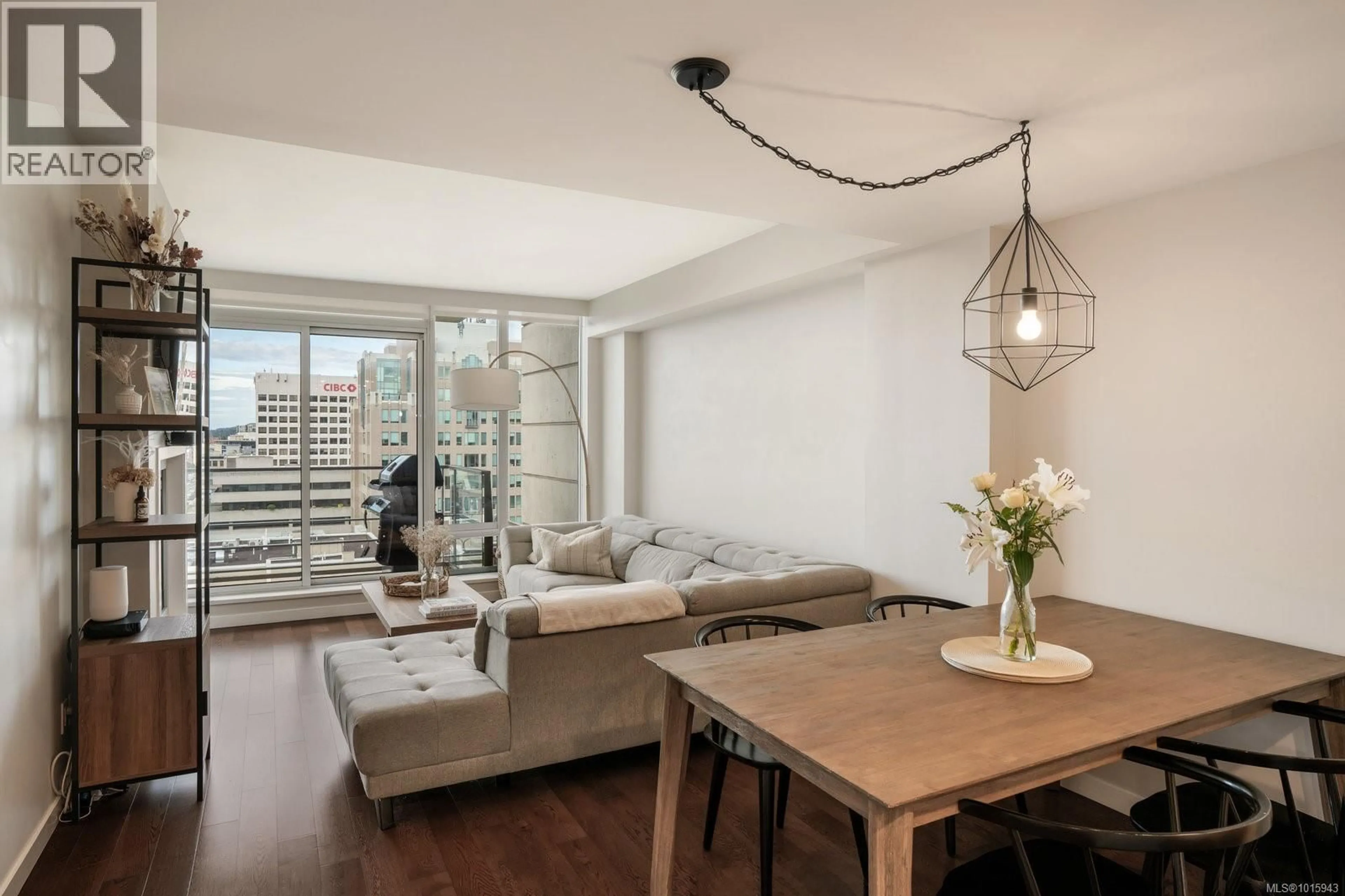 Living room with furniture, wood/laminate floor for 1503 - 707 COURTNEY STREET, Victoria British Columbia V9W0A9